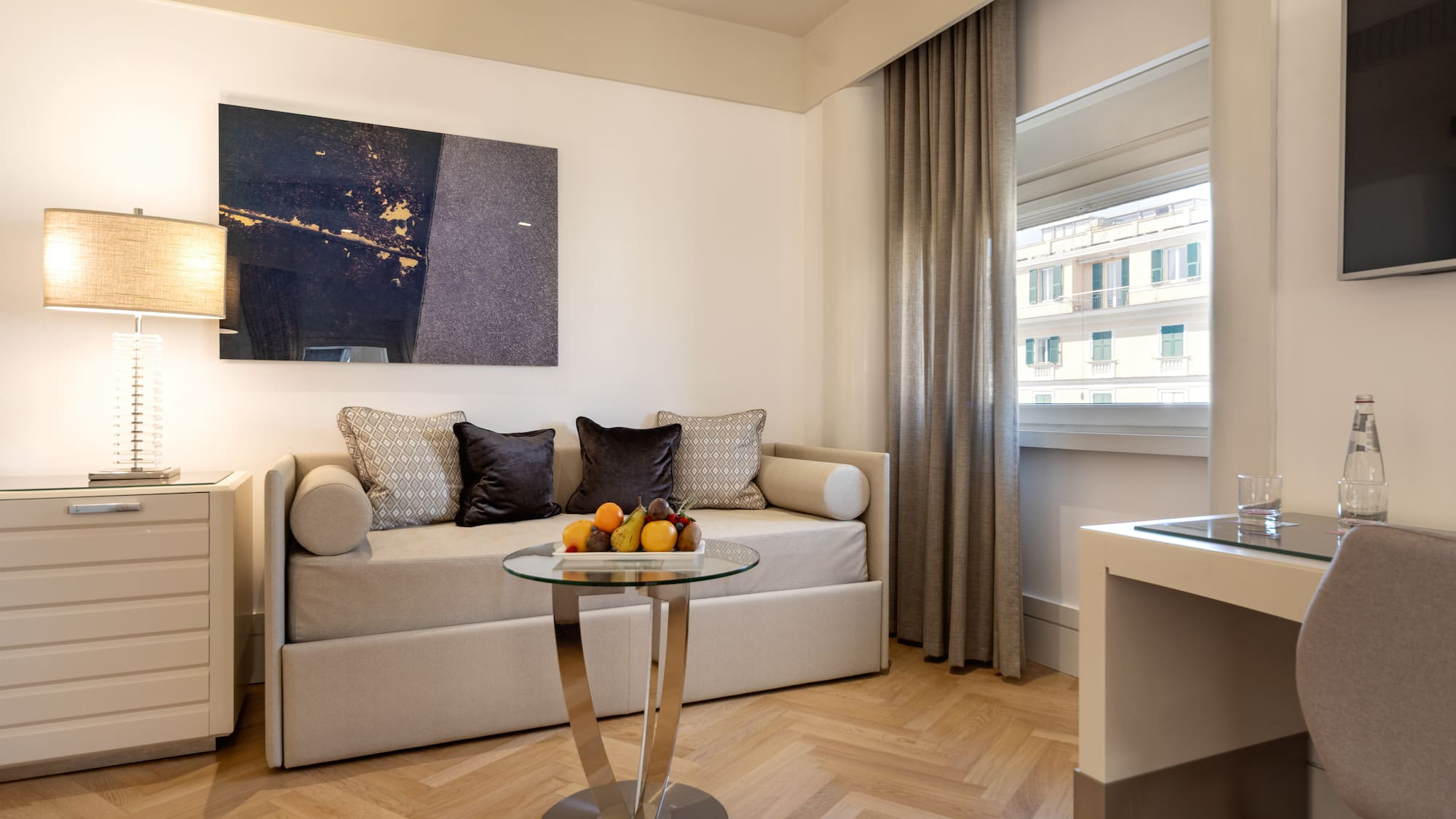 a room with a couch and a glass table