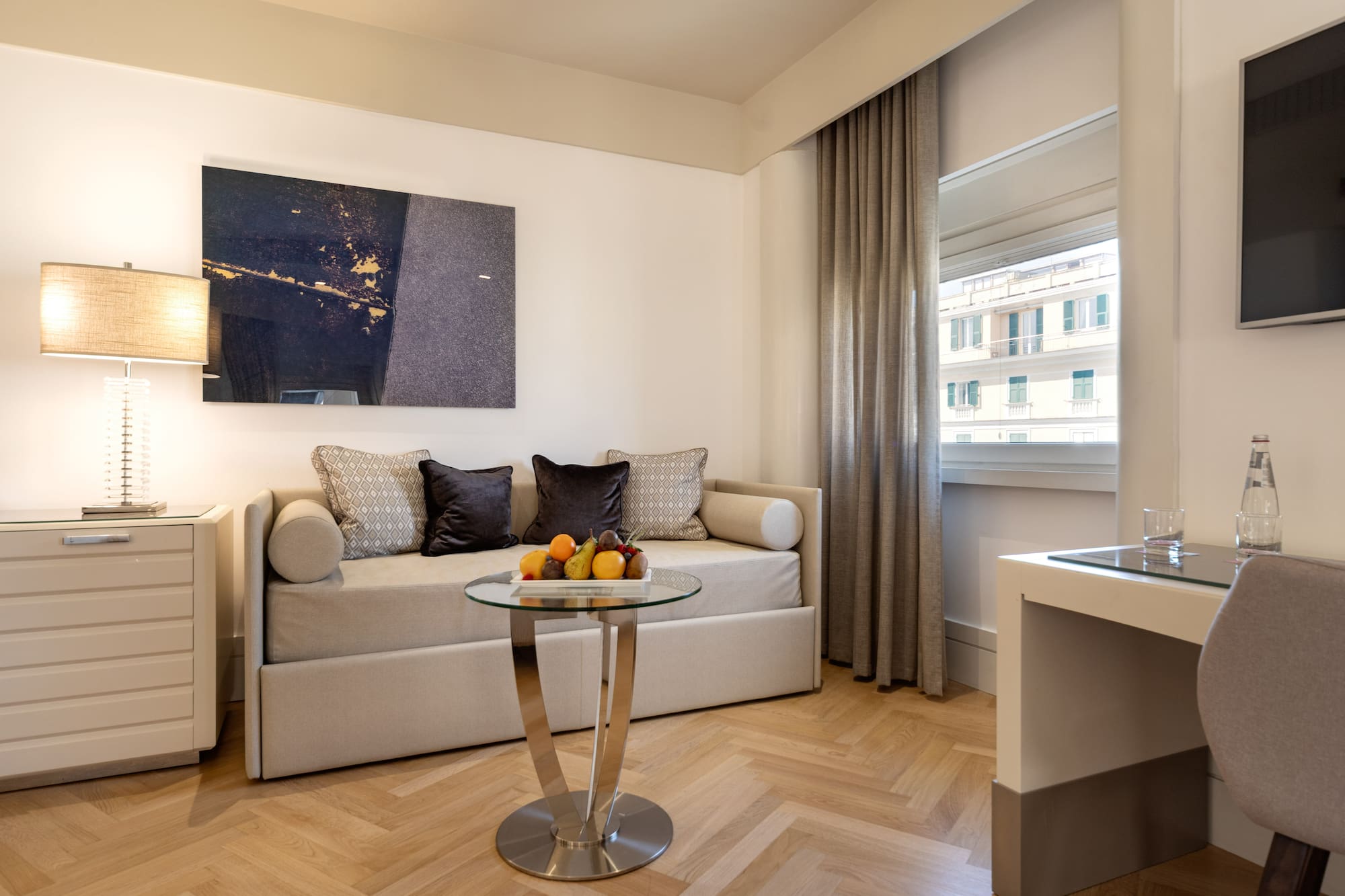 a room with a couch and a glass table