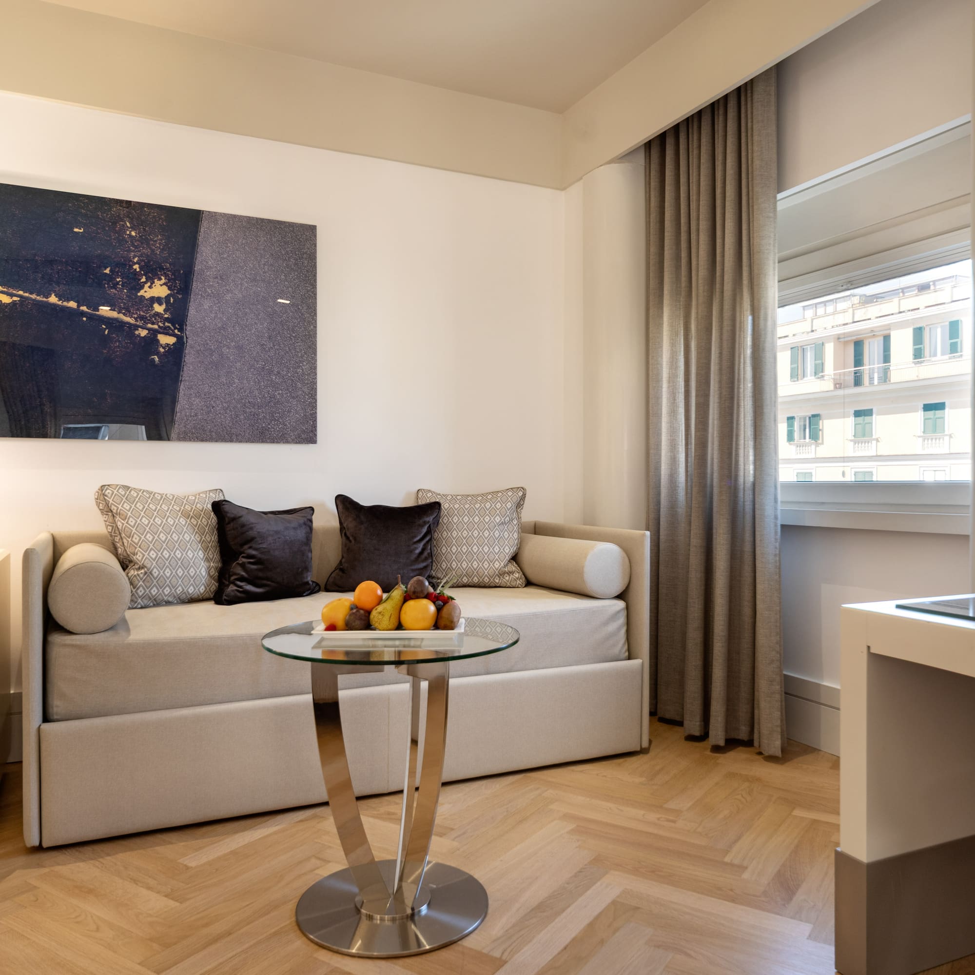 a room with a couch and a glass table