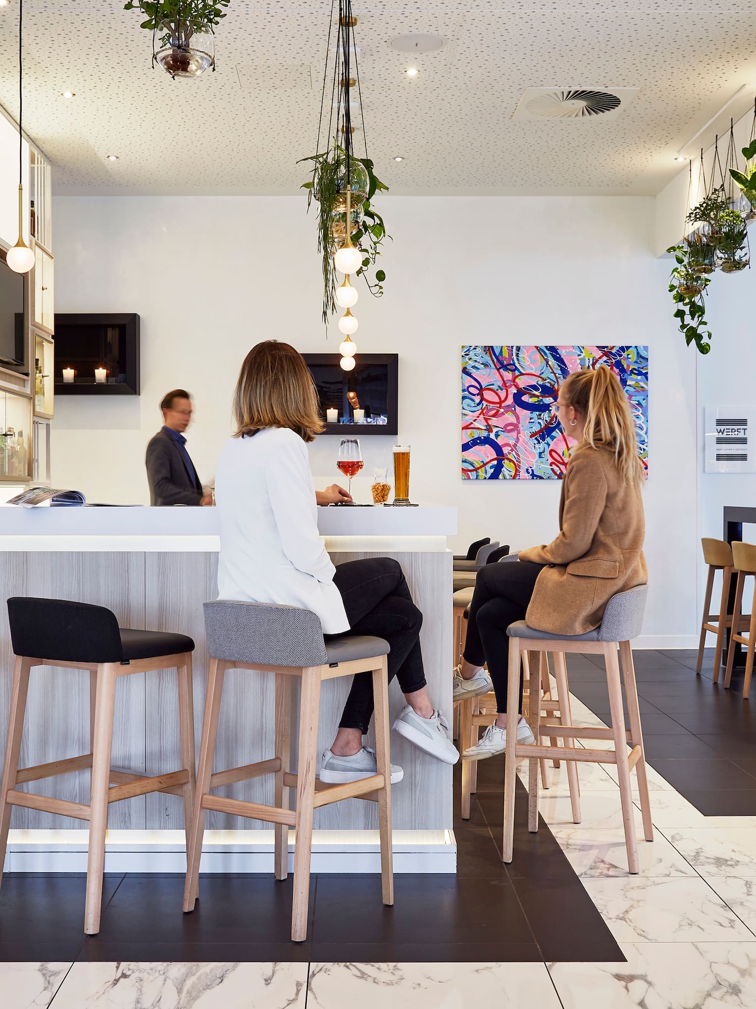 people sitting at a bar