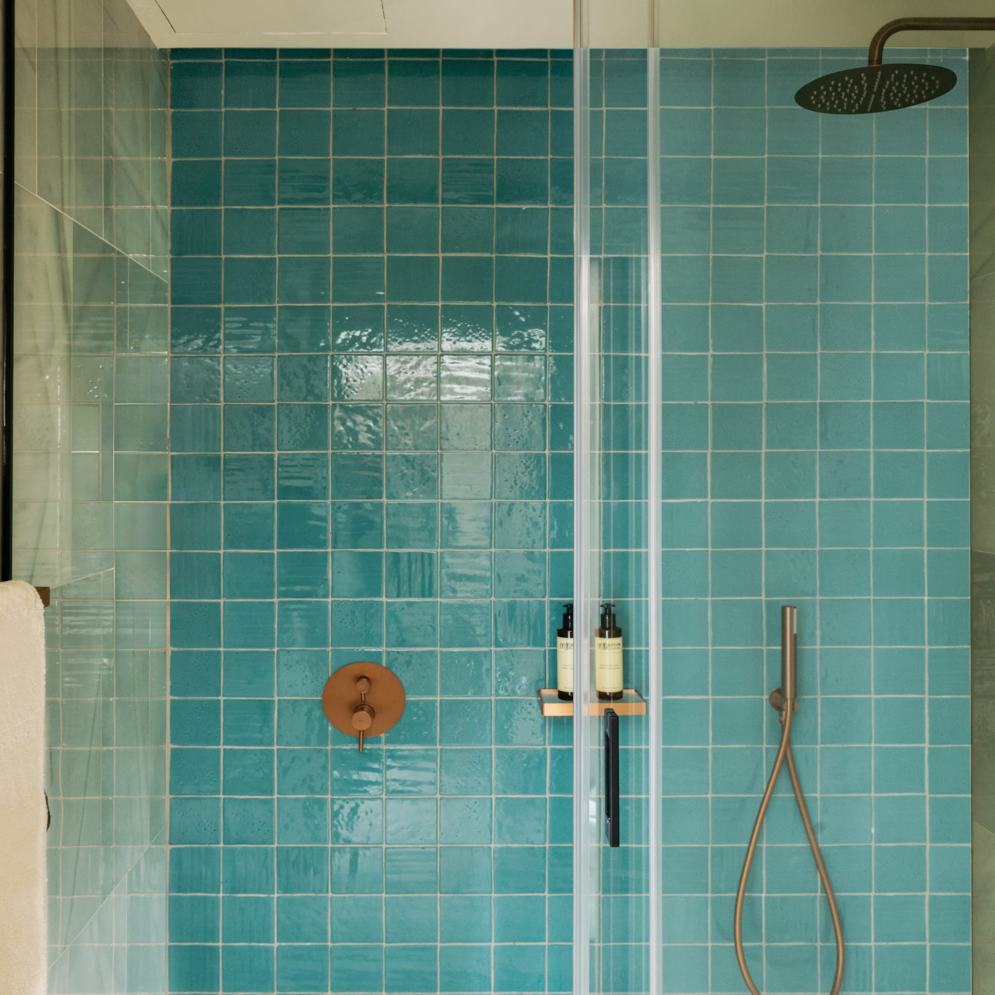 a shower with a shower head and a shower head