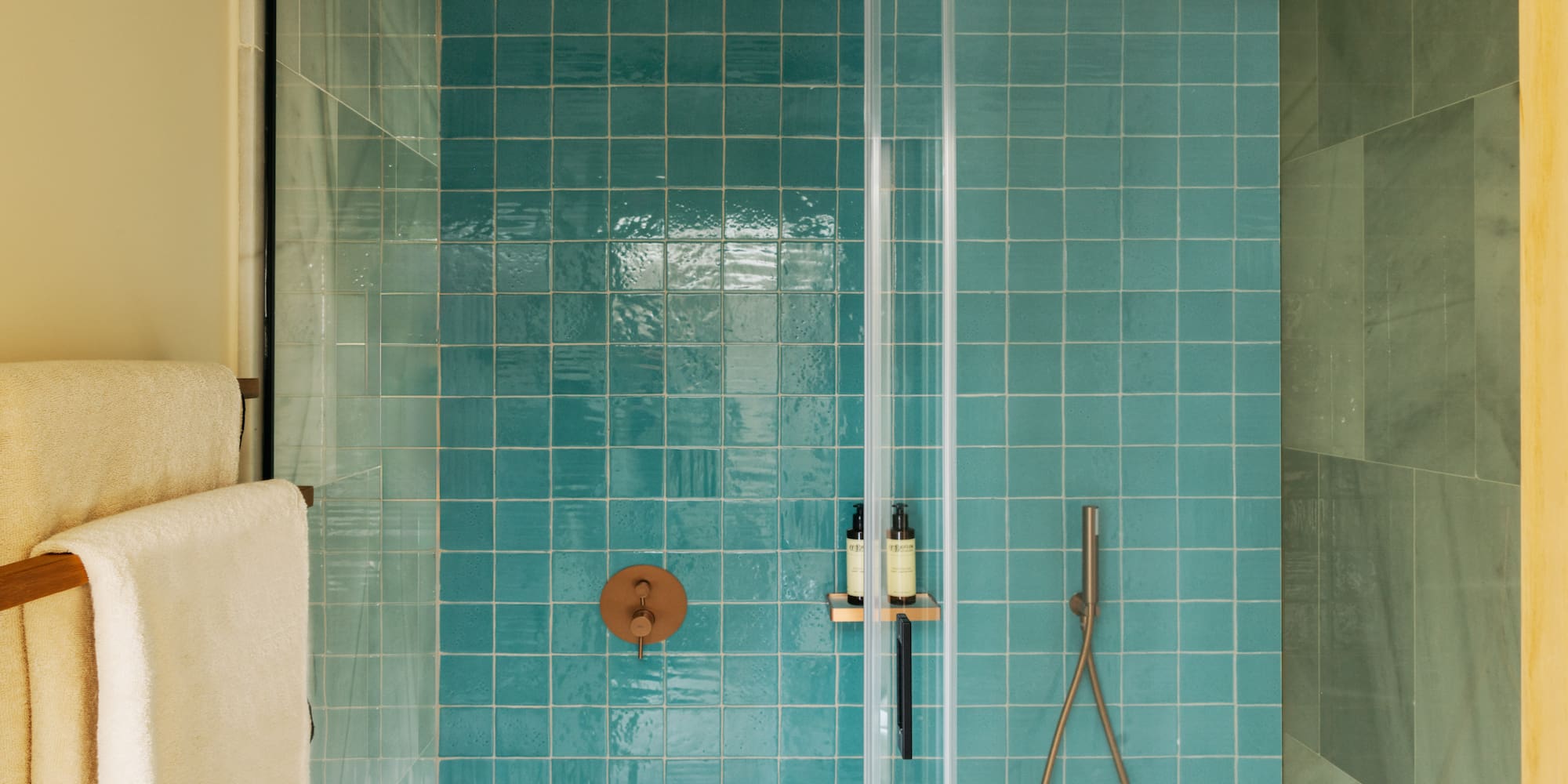 a shower with a shower head and a shower head