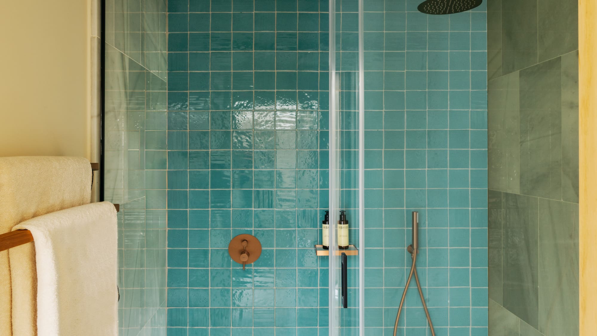 a shower with a shower head and a shower head
