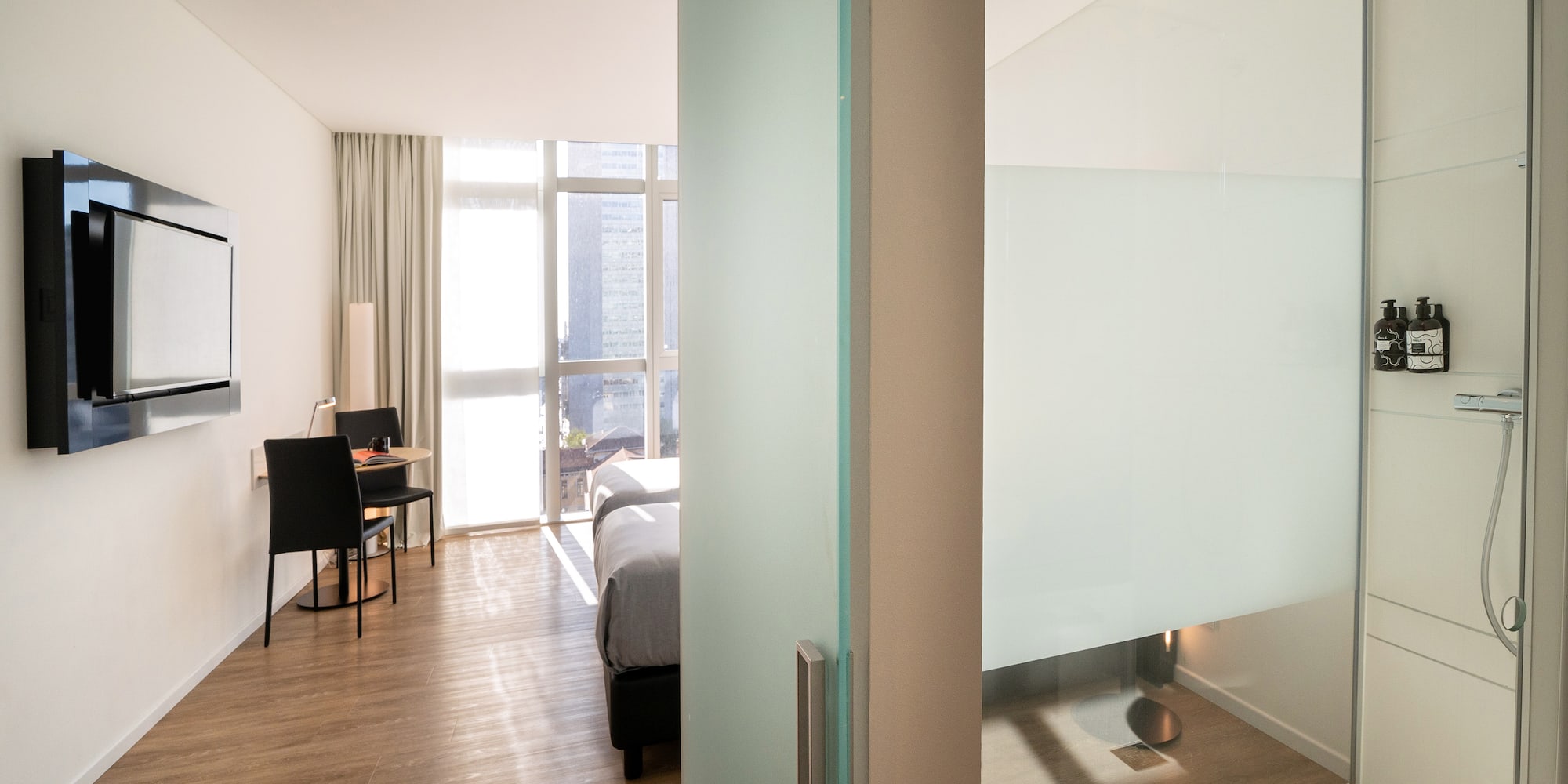 a room with a bed and a desk