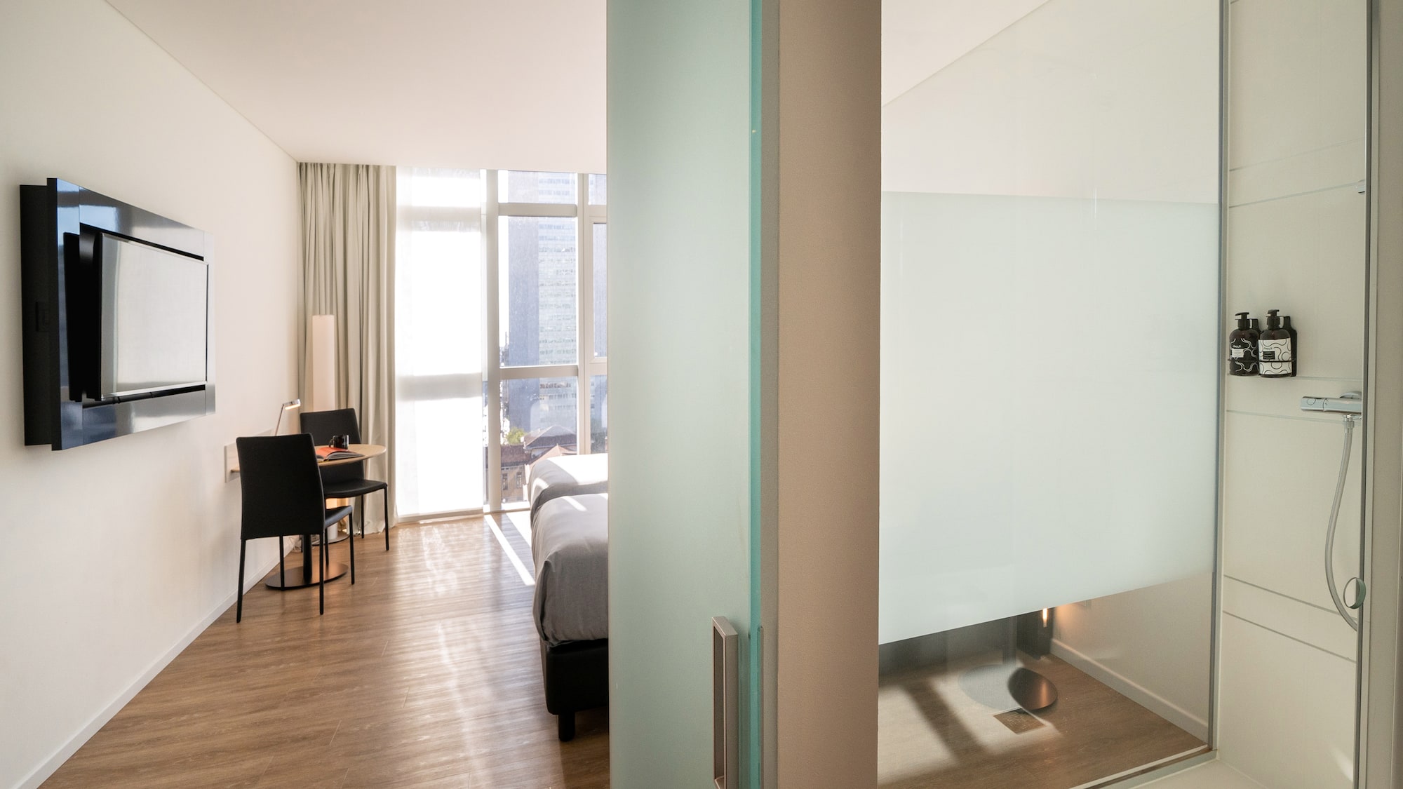 a room with a bed and a desk