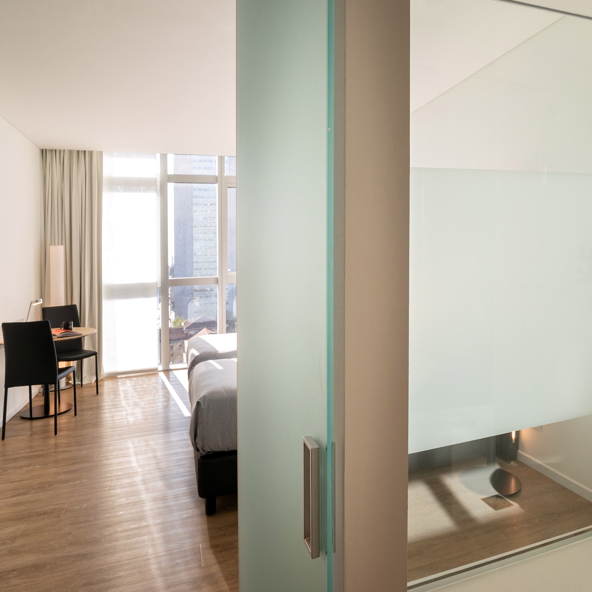 a room with a bed and a desk