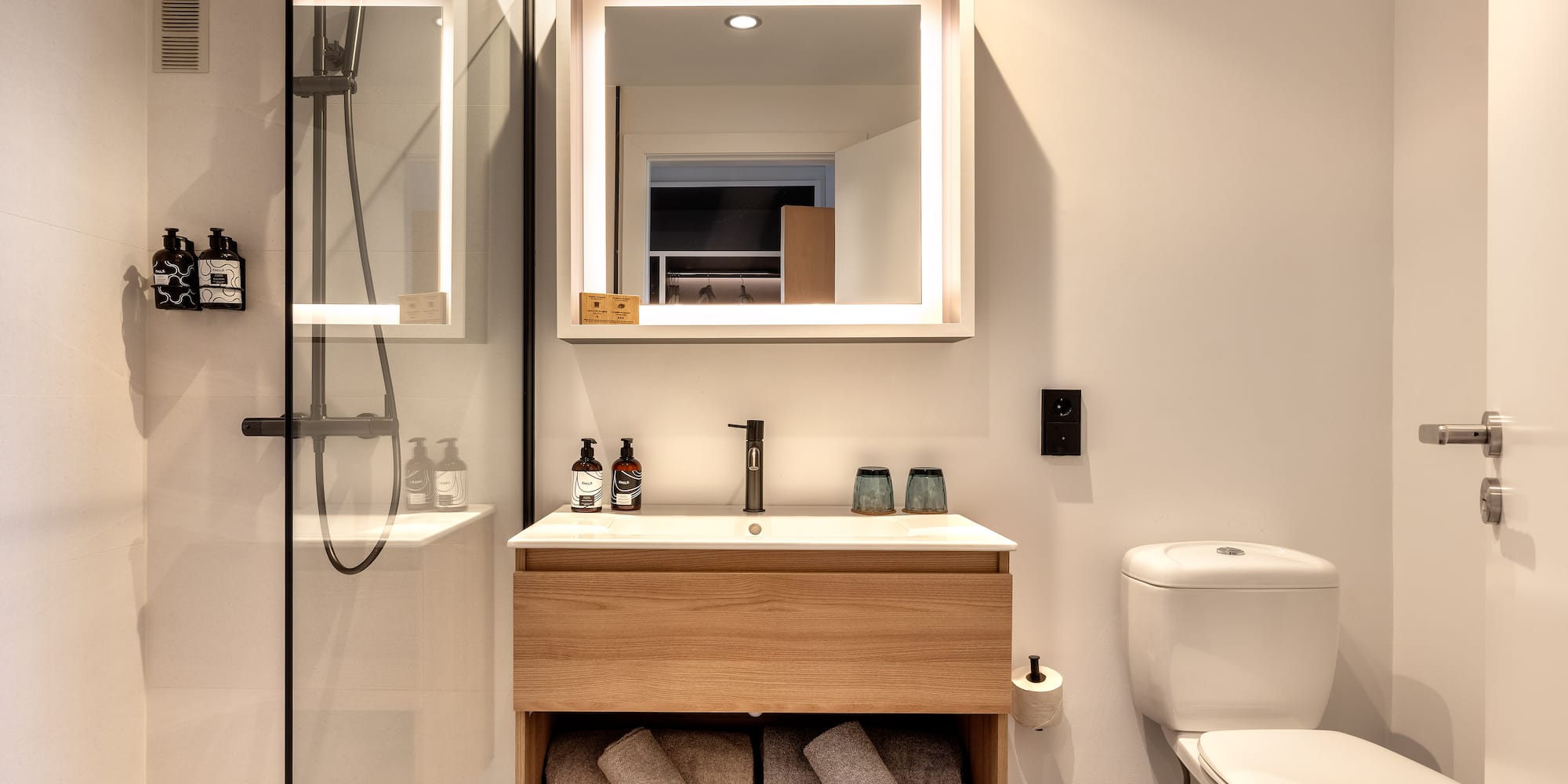 a bathroom with a mirror and a sink