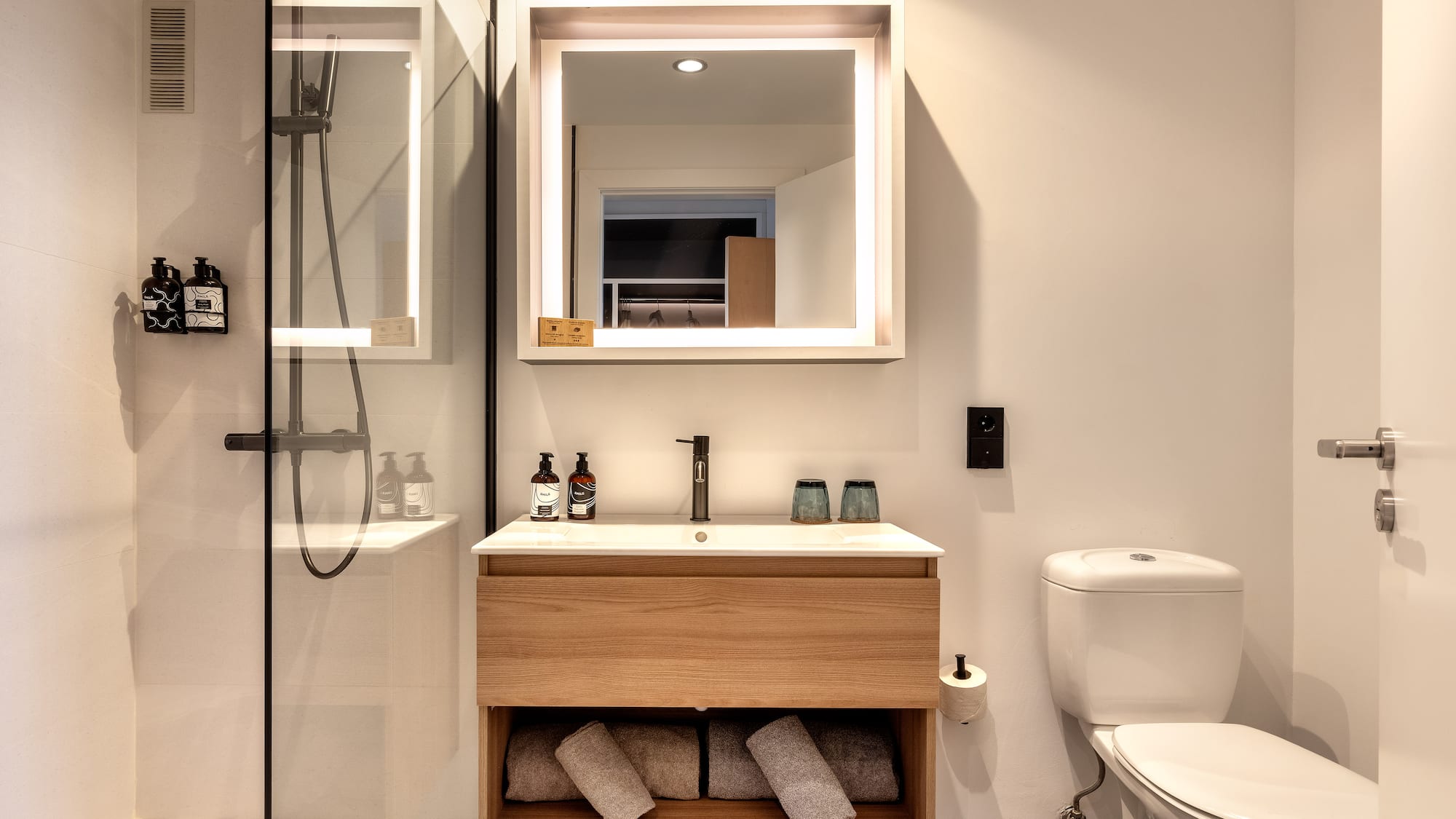 a bathroom with a mirror and a sink