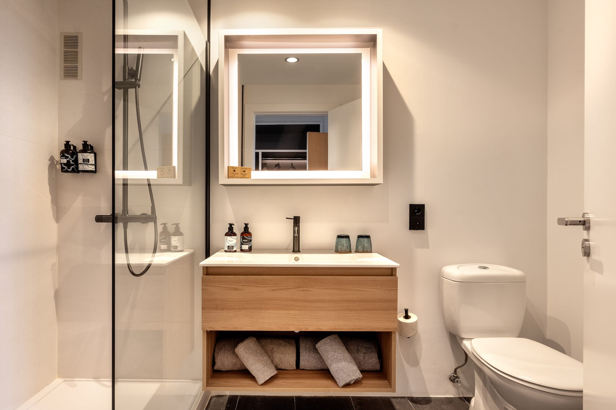 a bathroom with a mirror and a sink