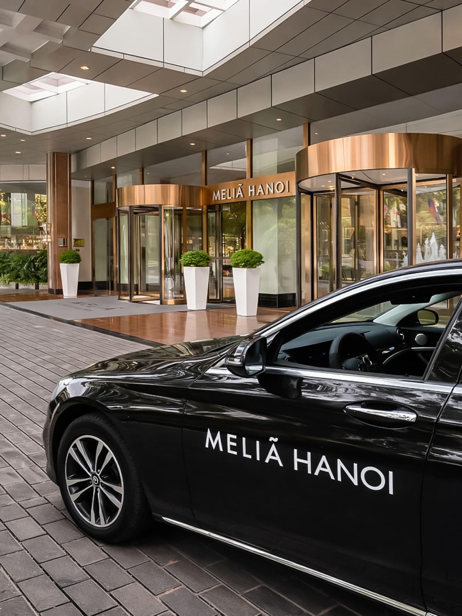 a black car parked outside of a building