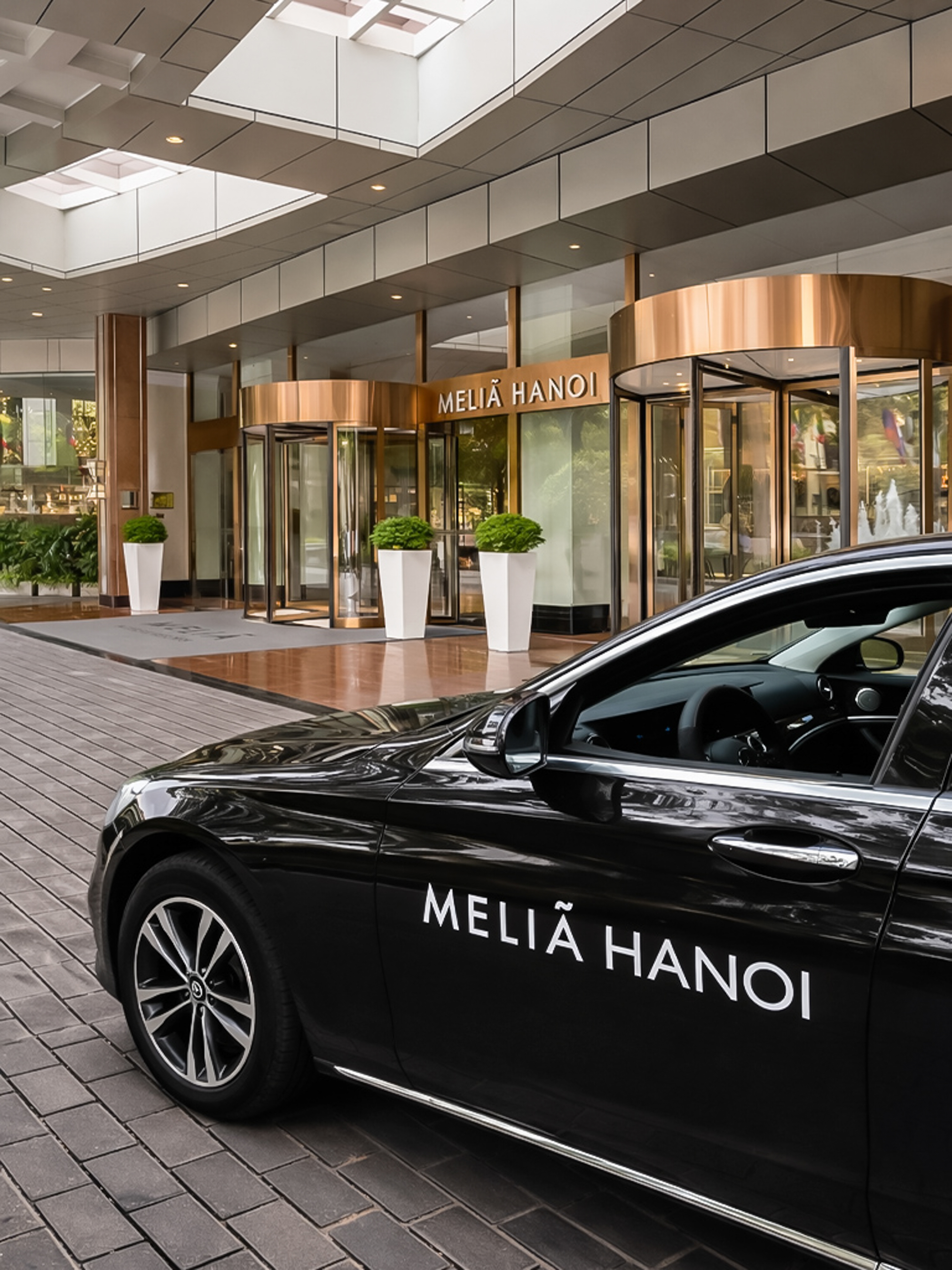 a black car parked outside of a building