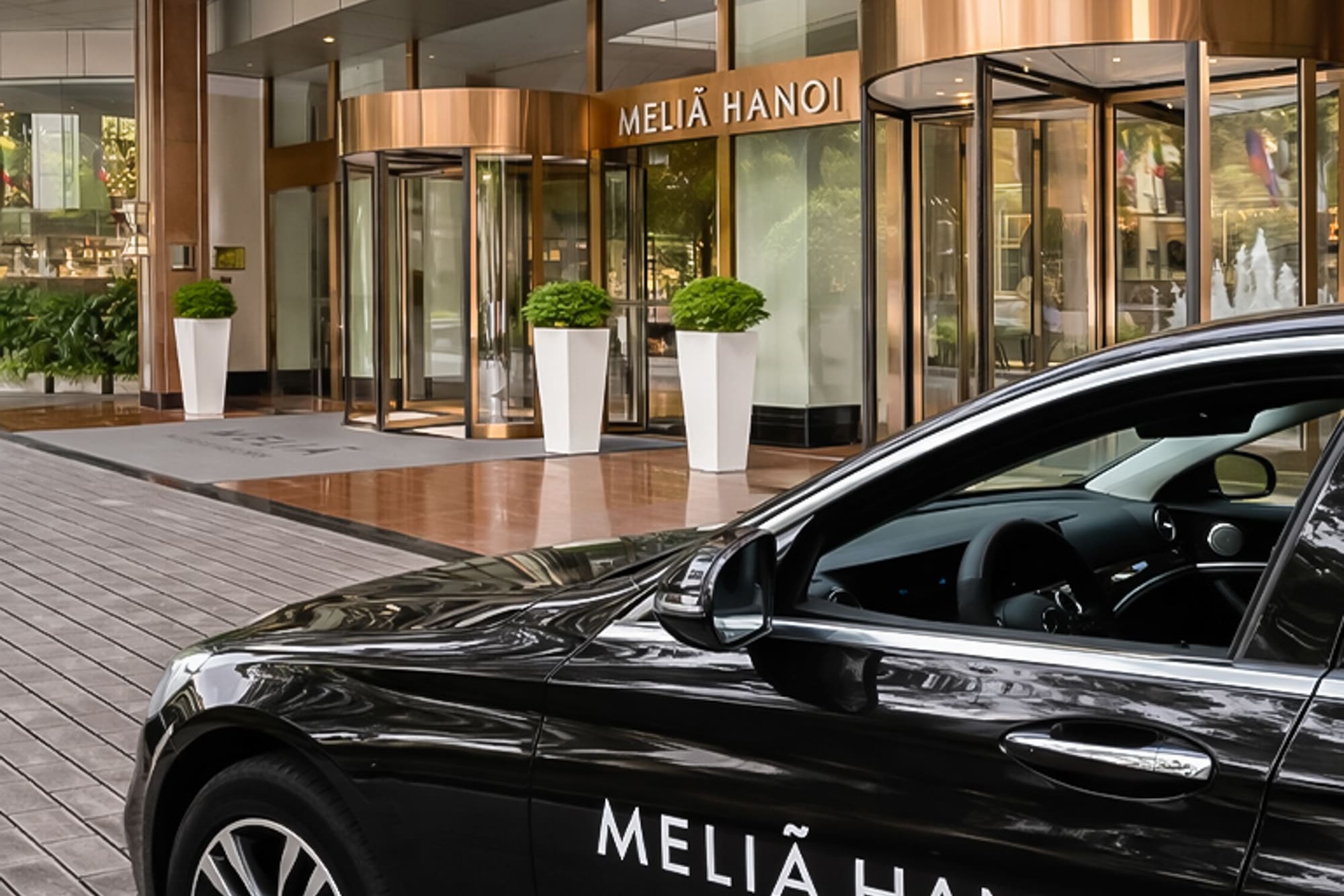 a black car parked outside of a building