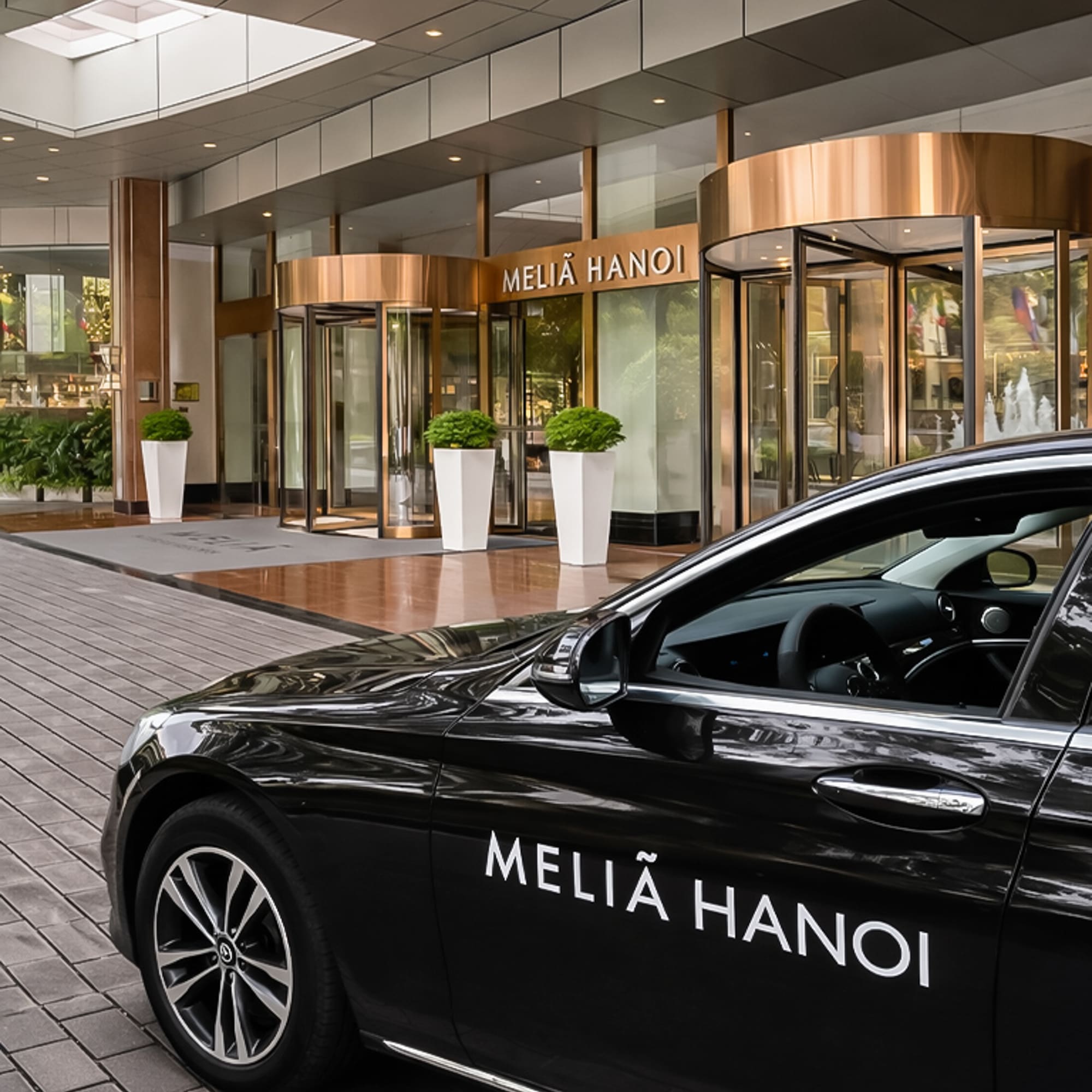 a black car parked outside of a building