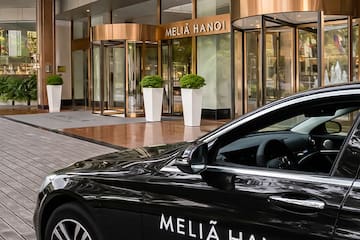 a black car parked outside of a building
