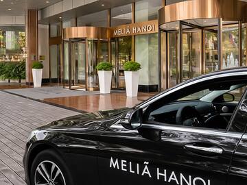 a black car parked outside of a building