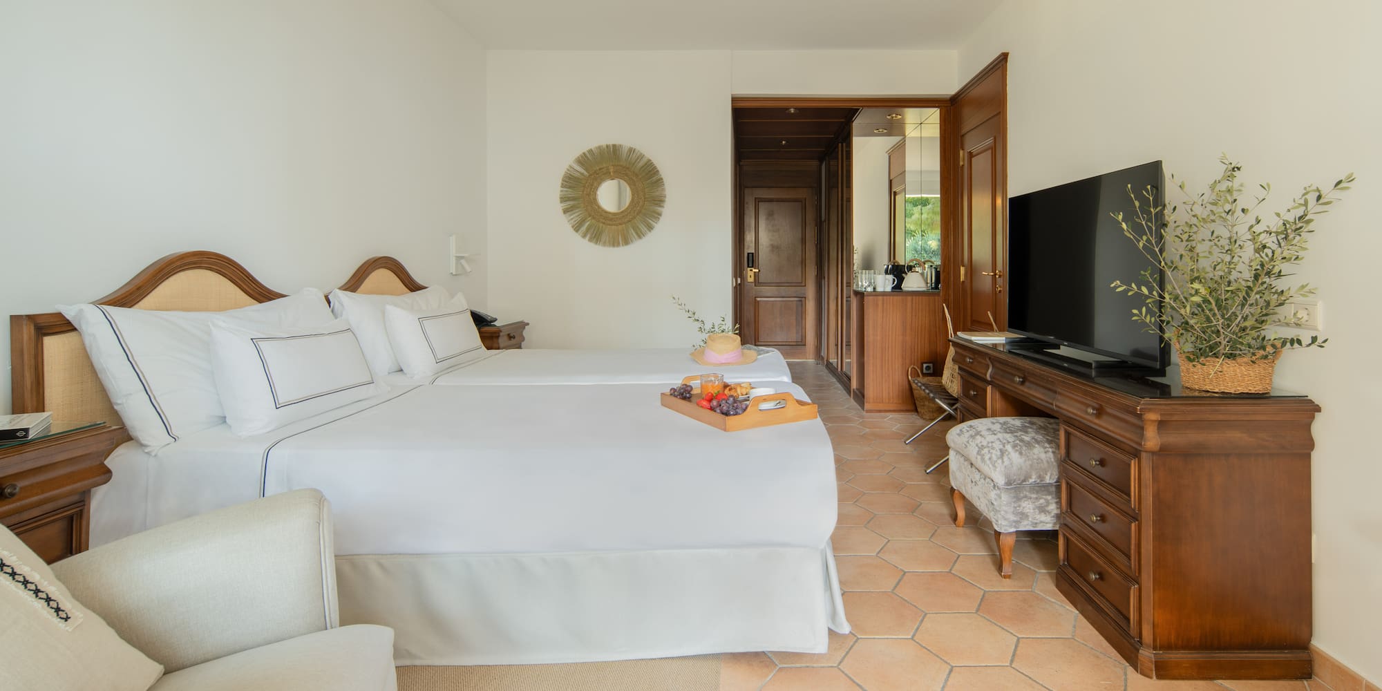 a room with a tv and a bed