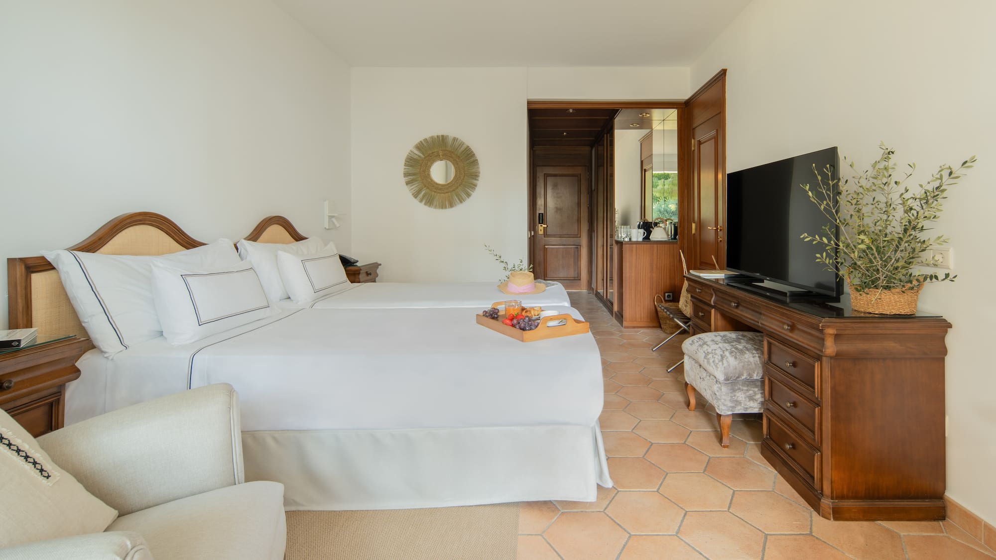 a room with a tv and a bed