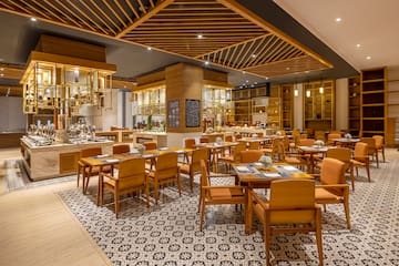 a restaurant with tables and chairs