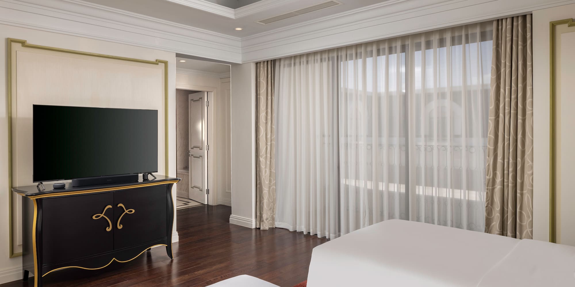 a room with a tv and a bed