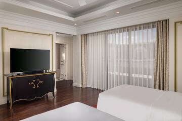a room with a tv and a bed
