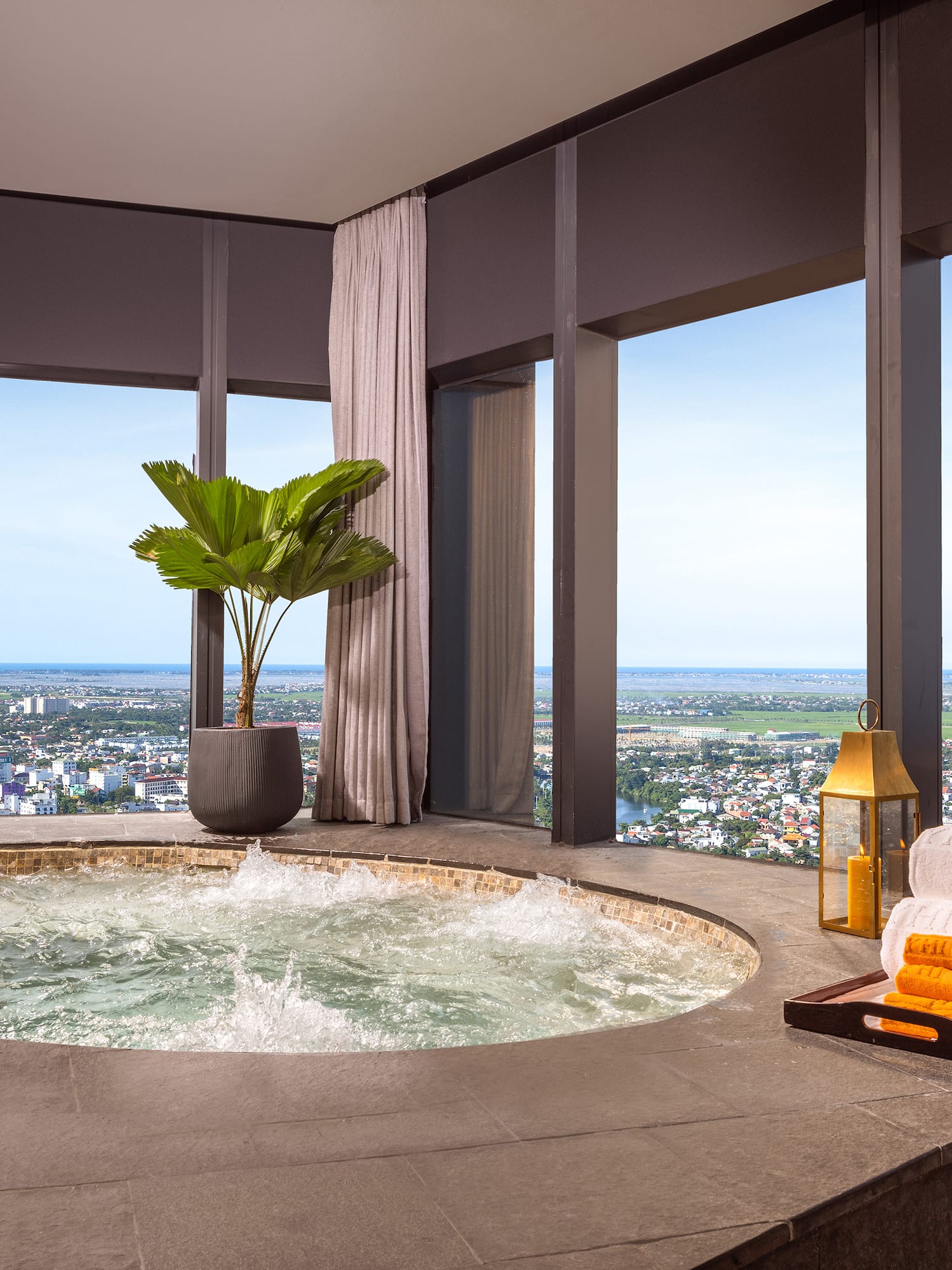 a hot tub with a view of a city