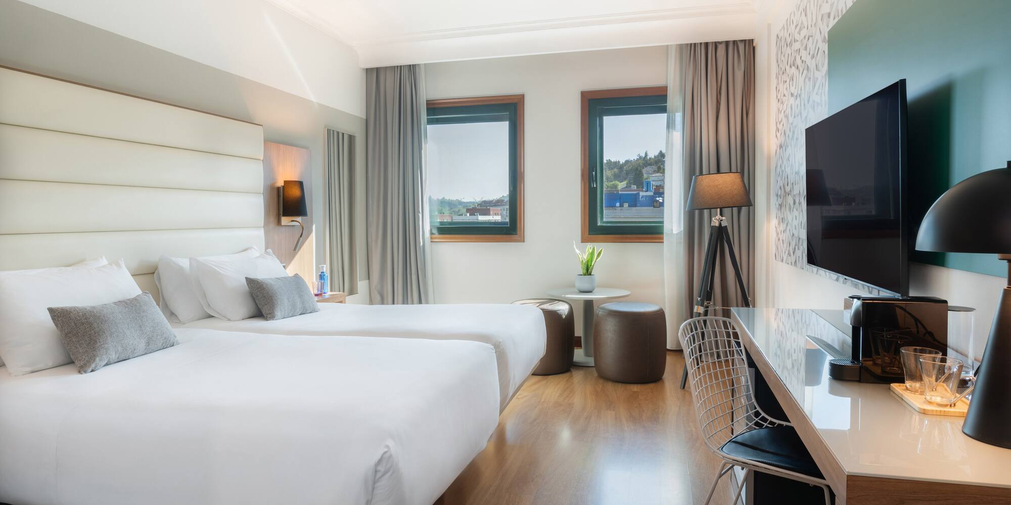 a room with two beds and a tv