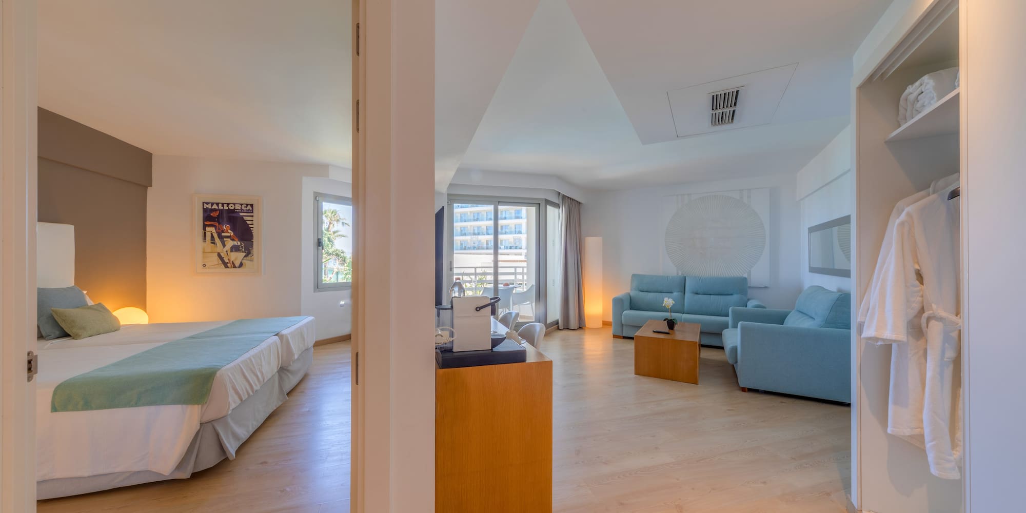 a room with two beds and a couch