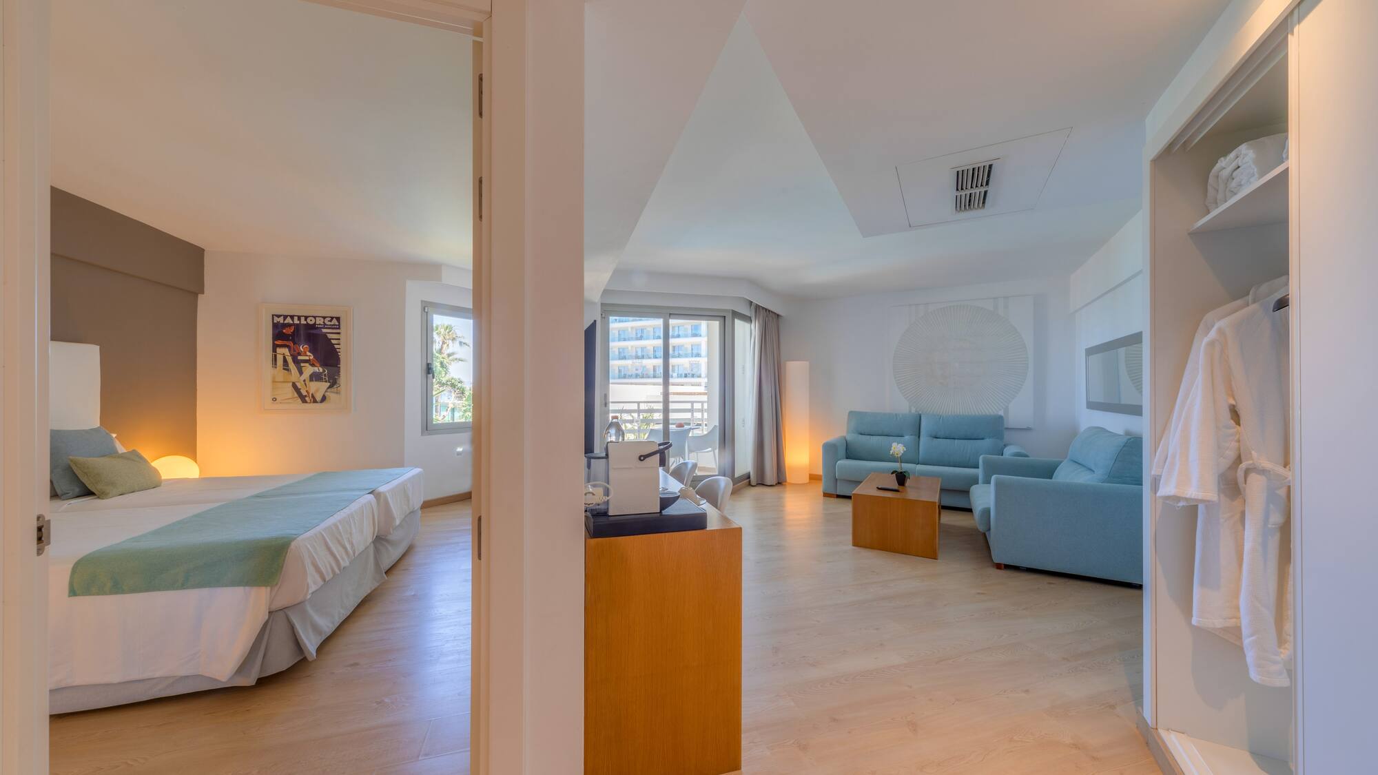 a room with two beds and a couch