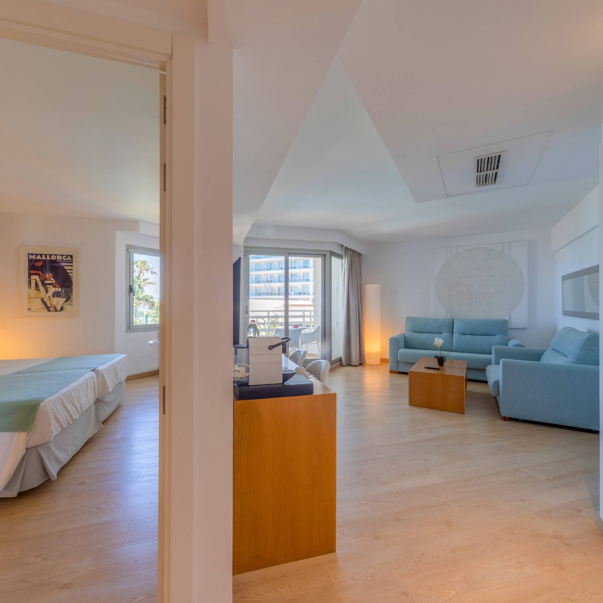 a room with two beds and a couch