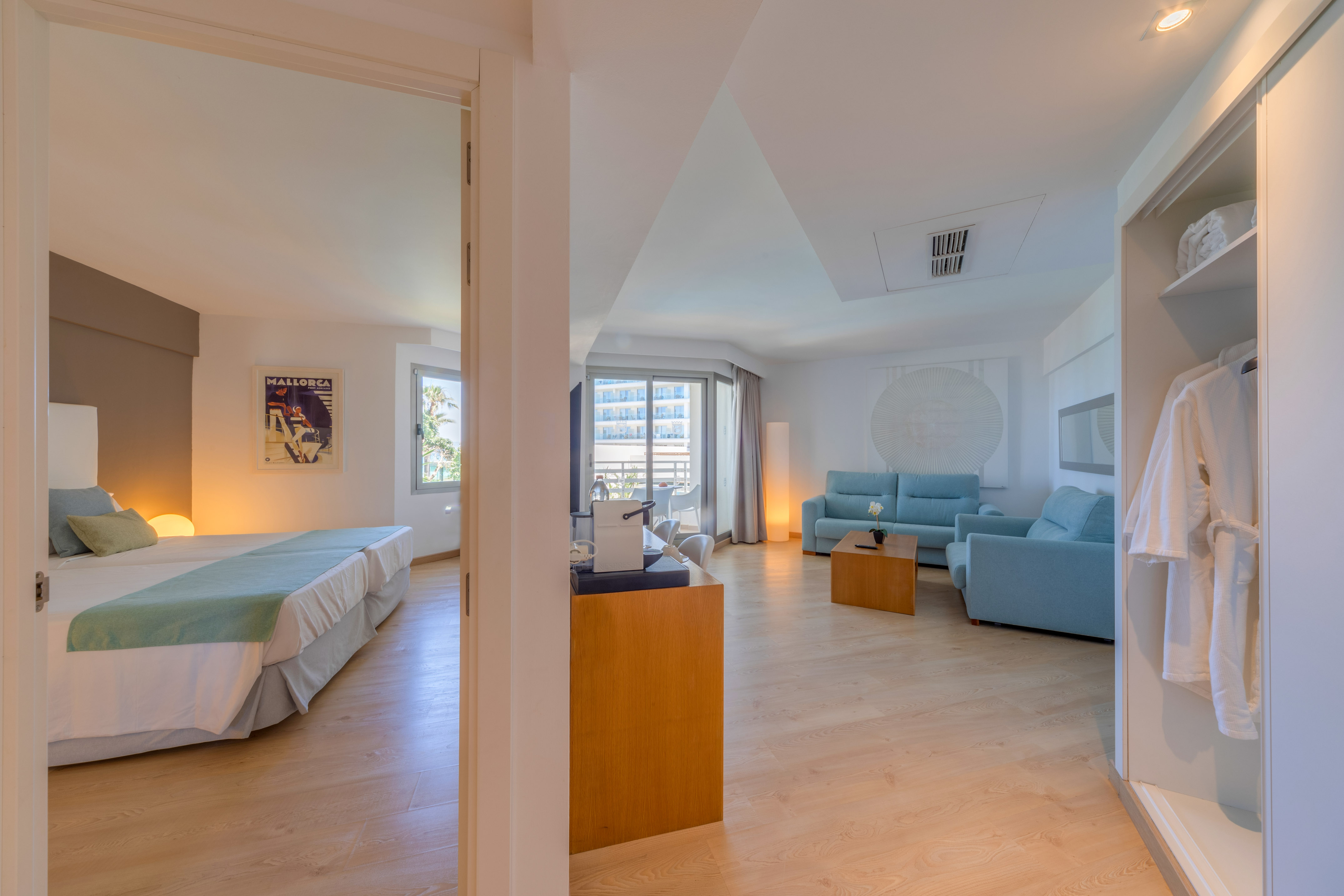 a room with two beds and a couch