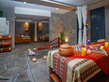 a room with a bed and a pot on it