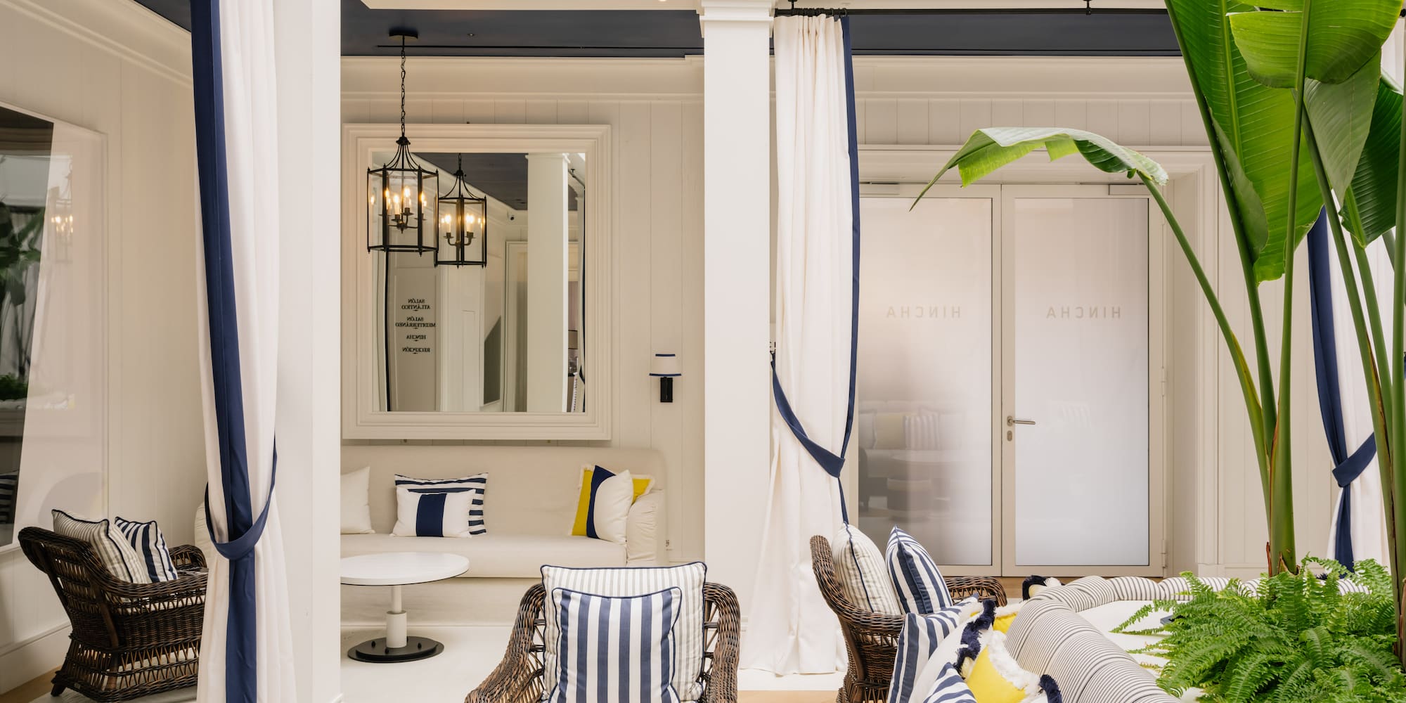 a room with a couch and chairs