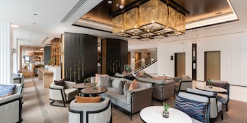 a room with couches and tables