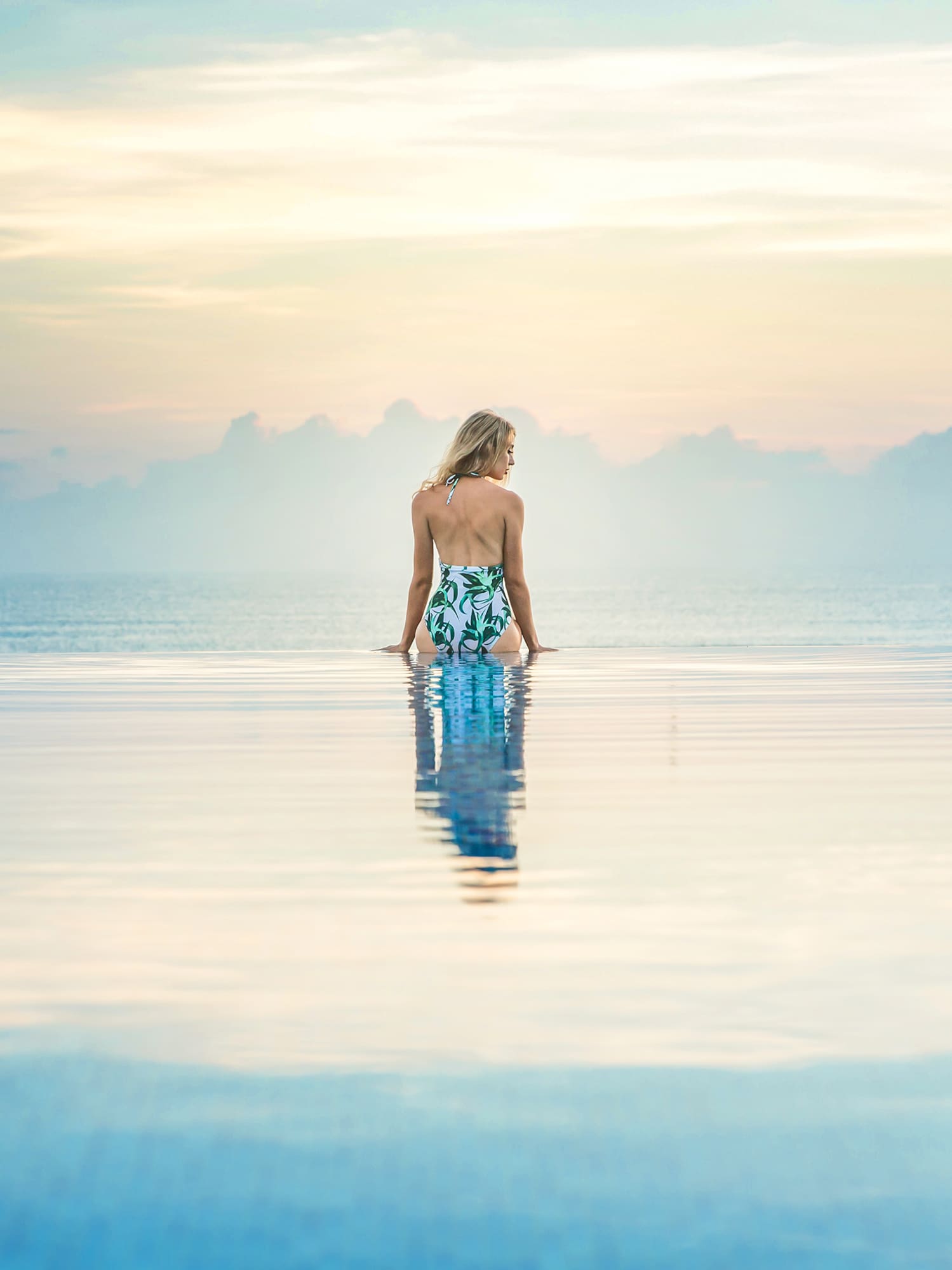 a woman standing in a pool of water