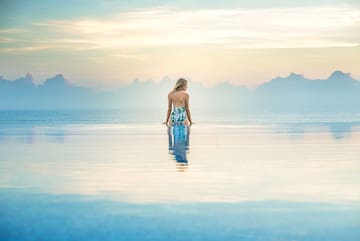 a woman standing in a pool of water