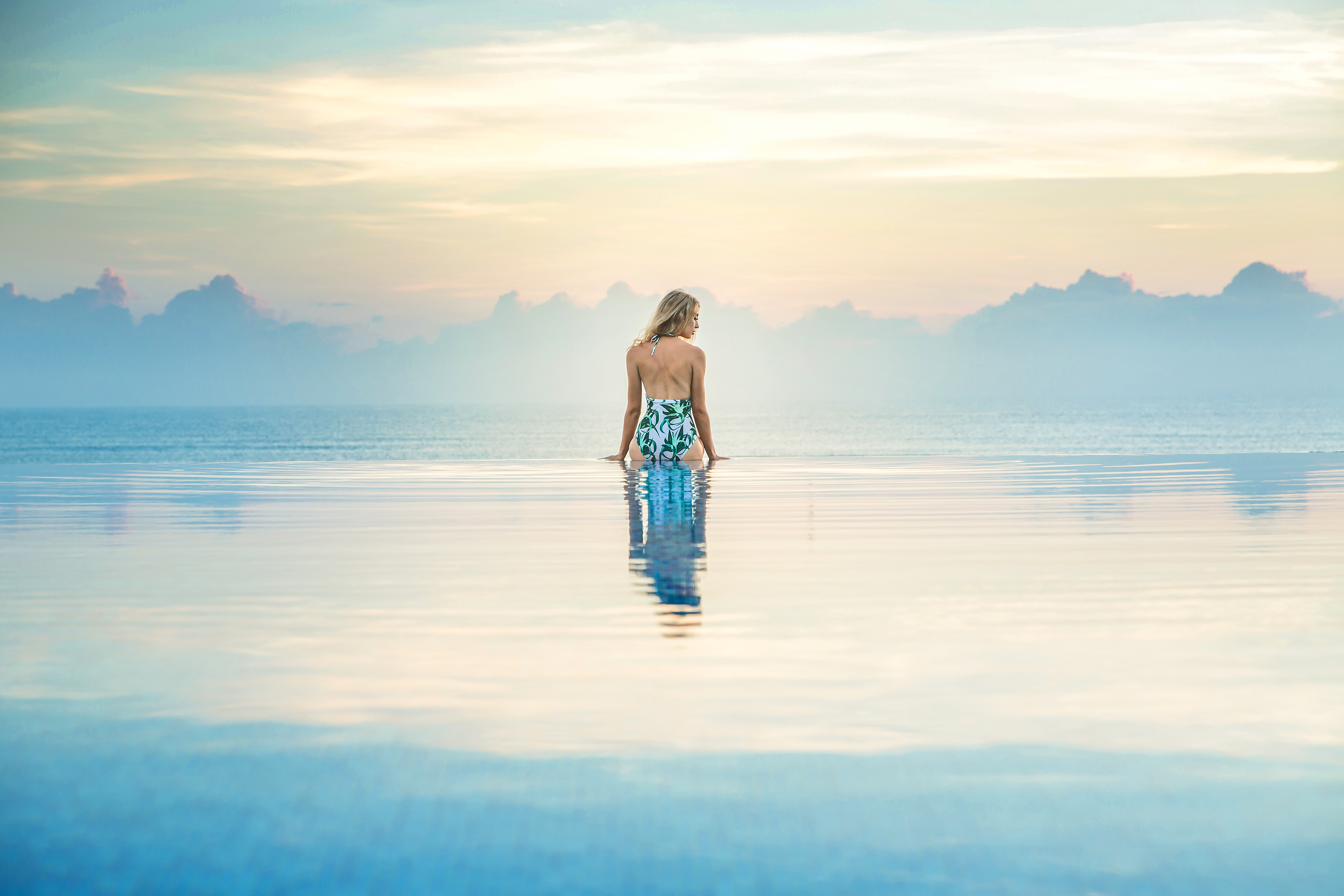 a woman standing in a pool of water