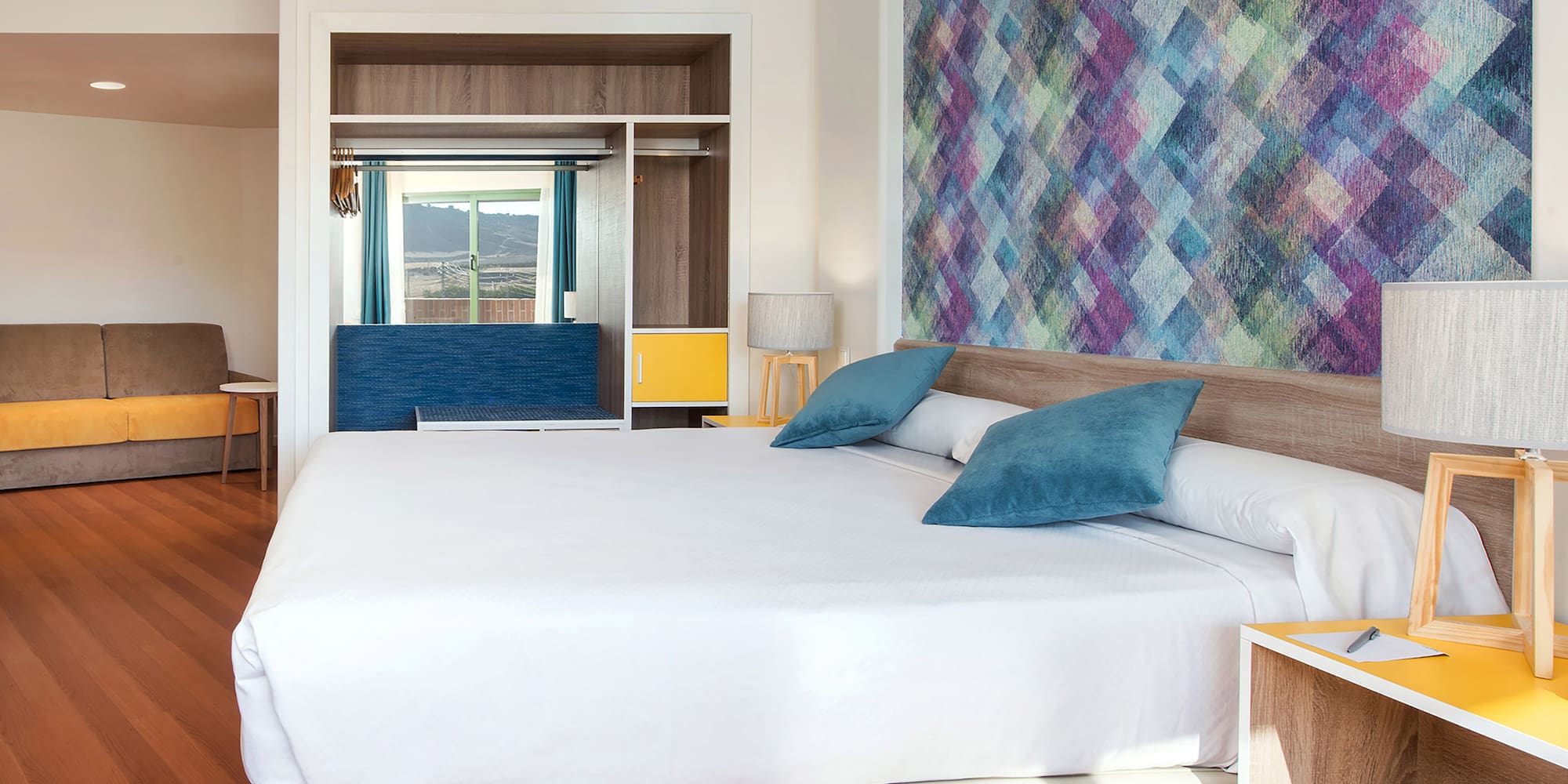 a bed with pillows in a room