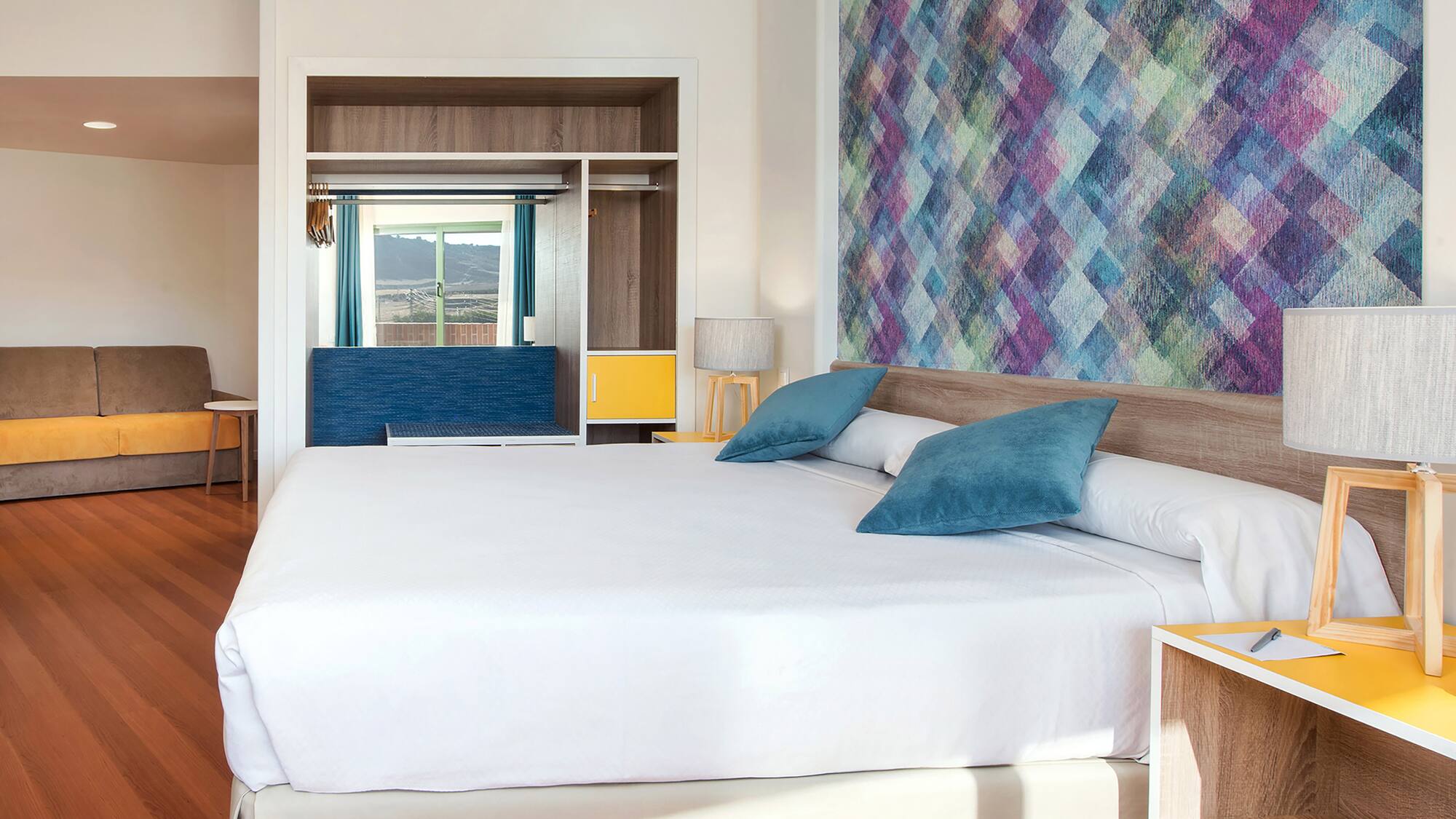 a bed with pillows in a room