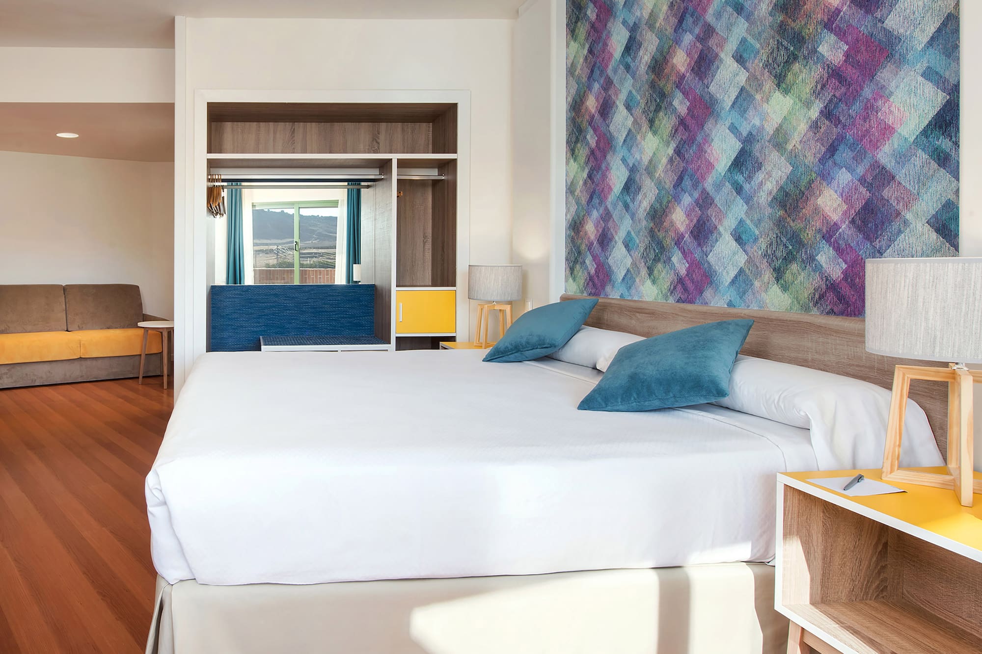 a bed with pillows in a room