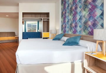 a bed with pillows in a room