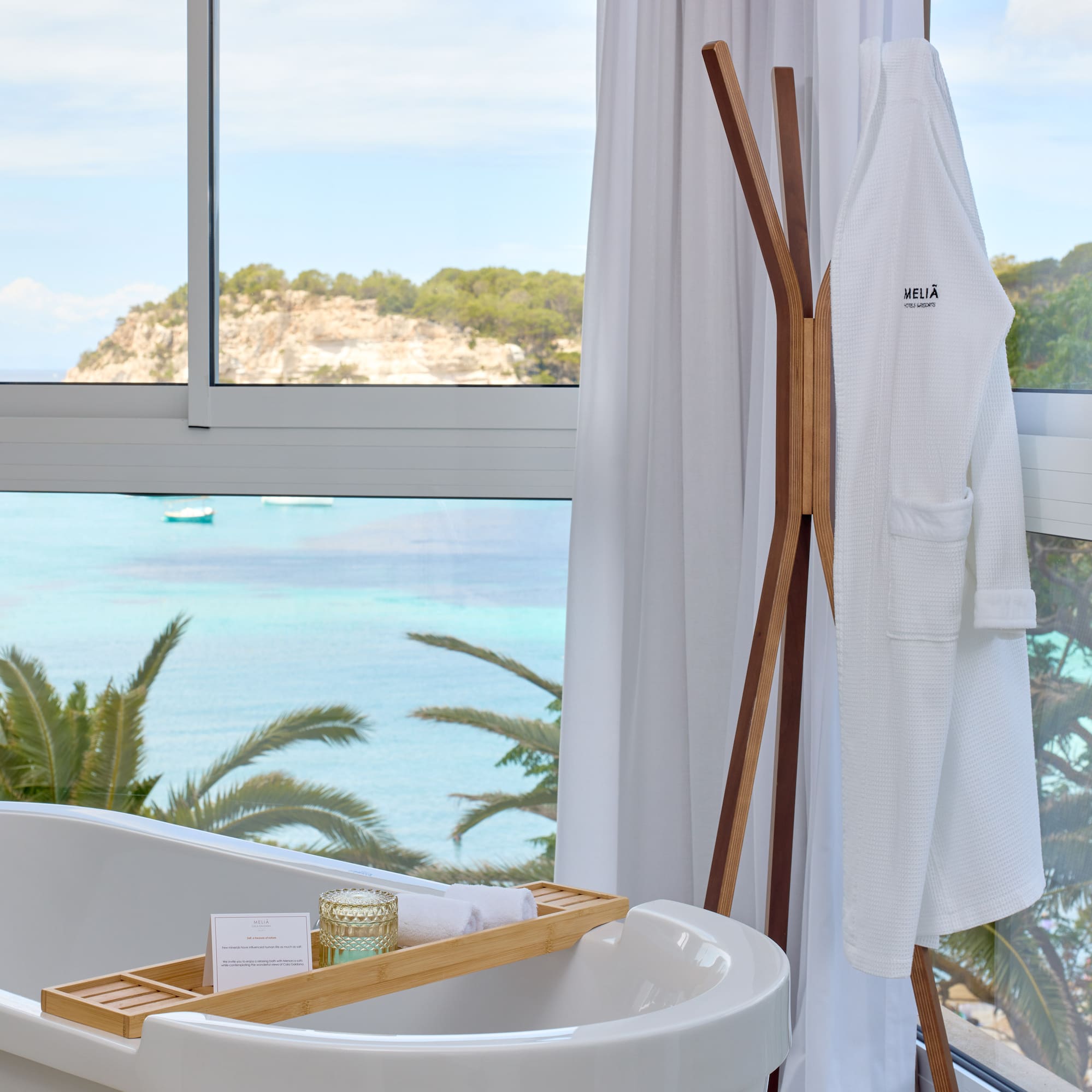 a bathtub next to a window