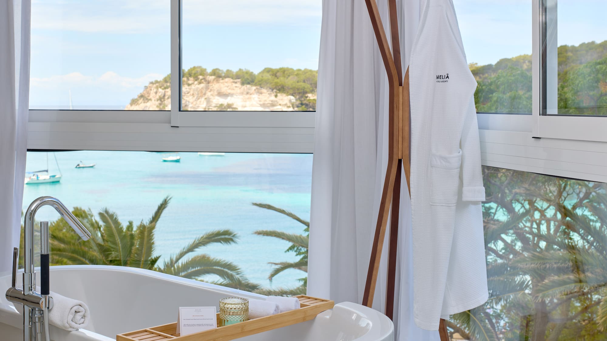 a bathtub next to a window