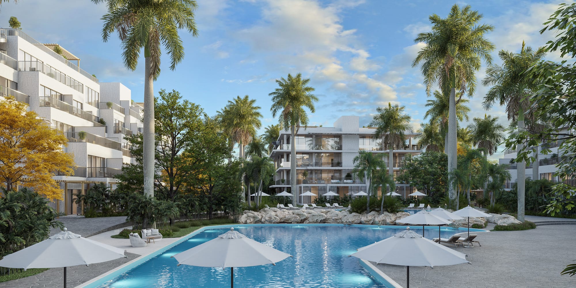 Piscina tropical de lujo con palmeras y modernos apartamentos resort.
