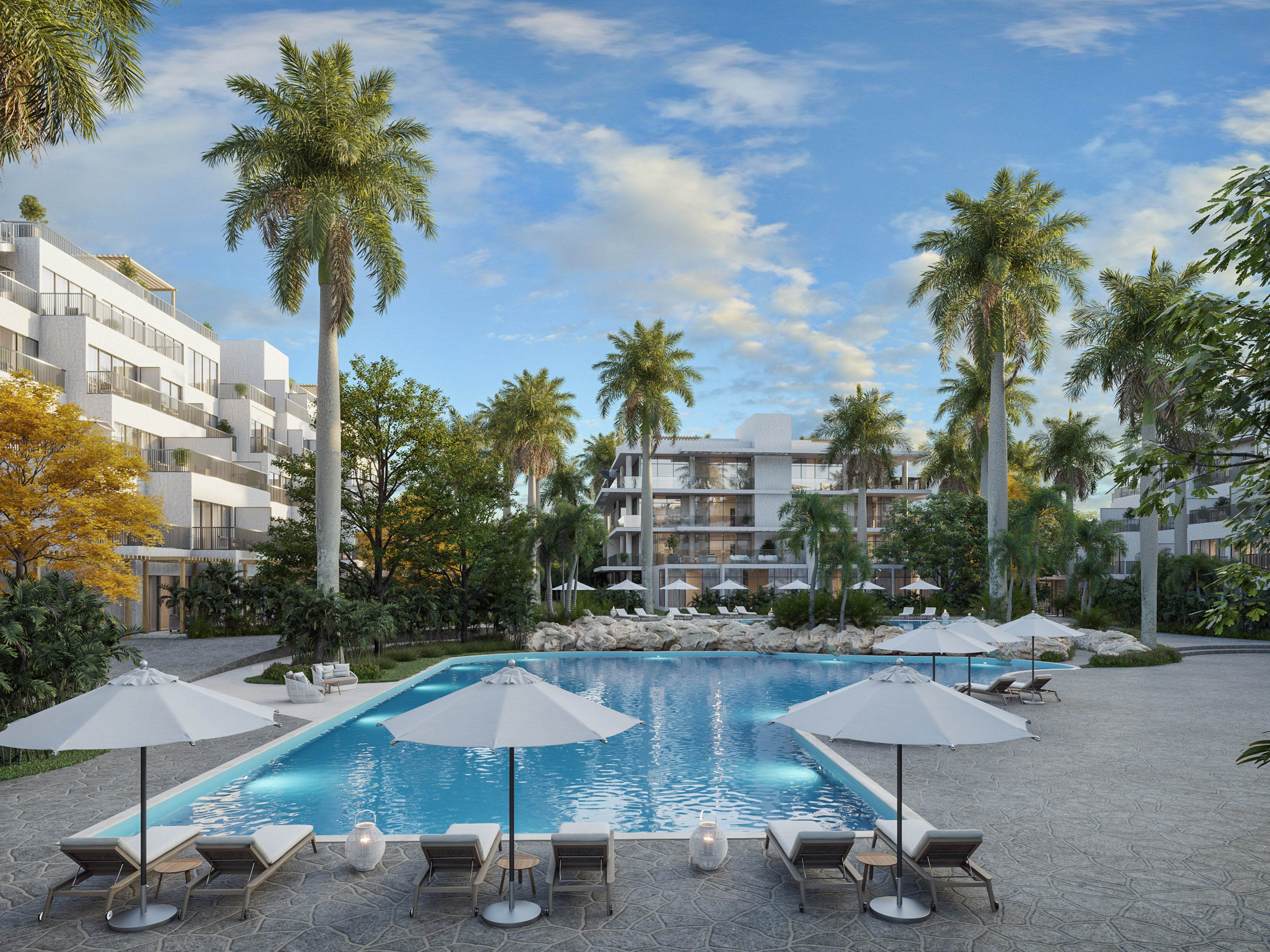 Piscina tropical de lujo con palmeras y modernos apartamentos resort.