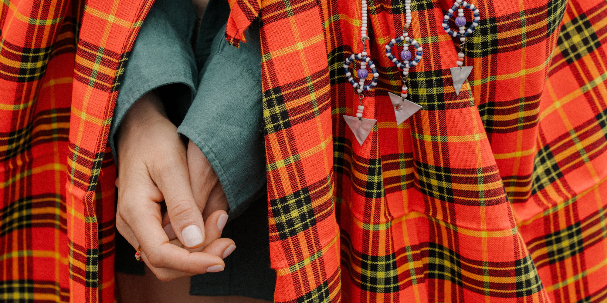 a person wearing a red and black plaid dress