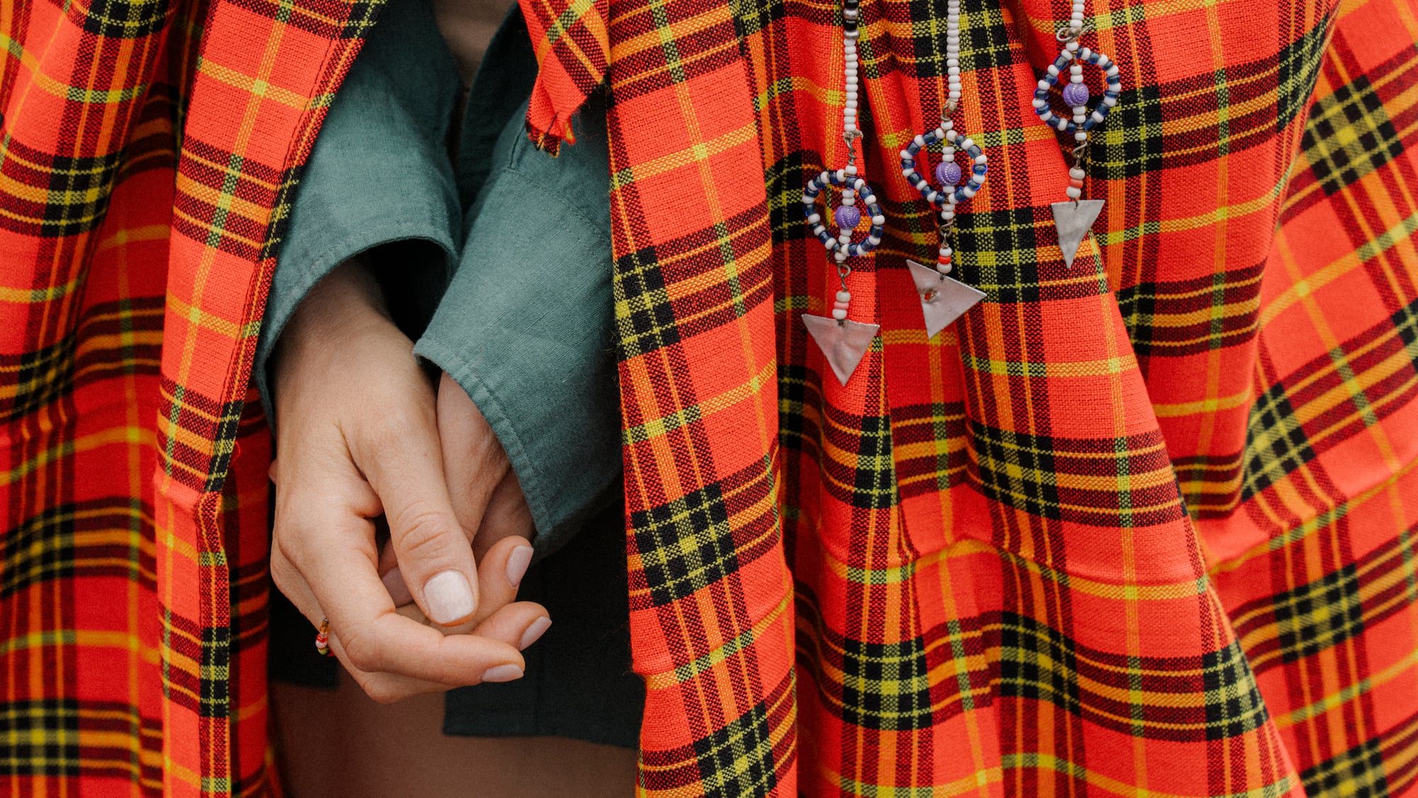 a person wearing a red and black plaid dress