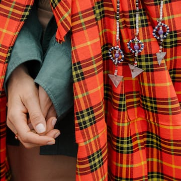 a person wearing a red and black plaid dress