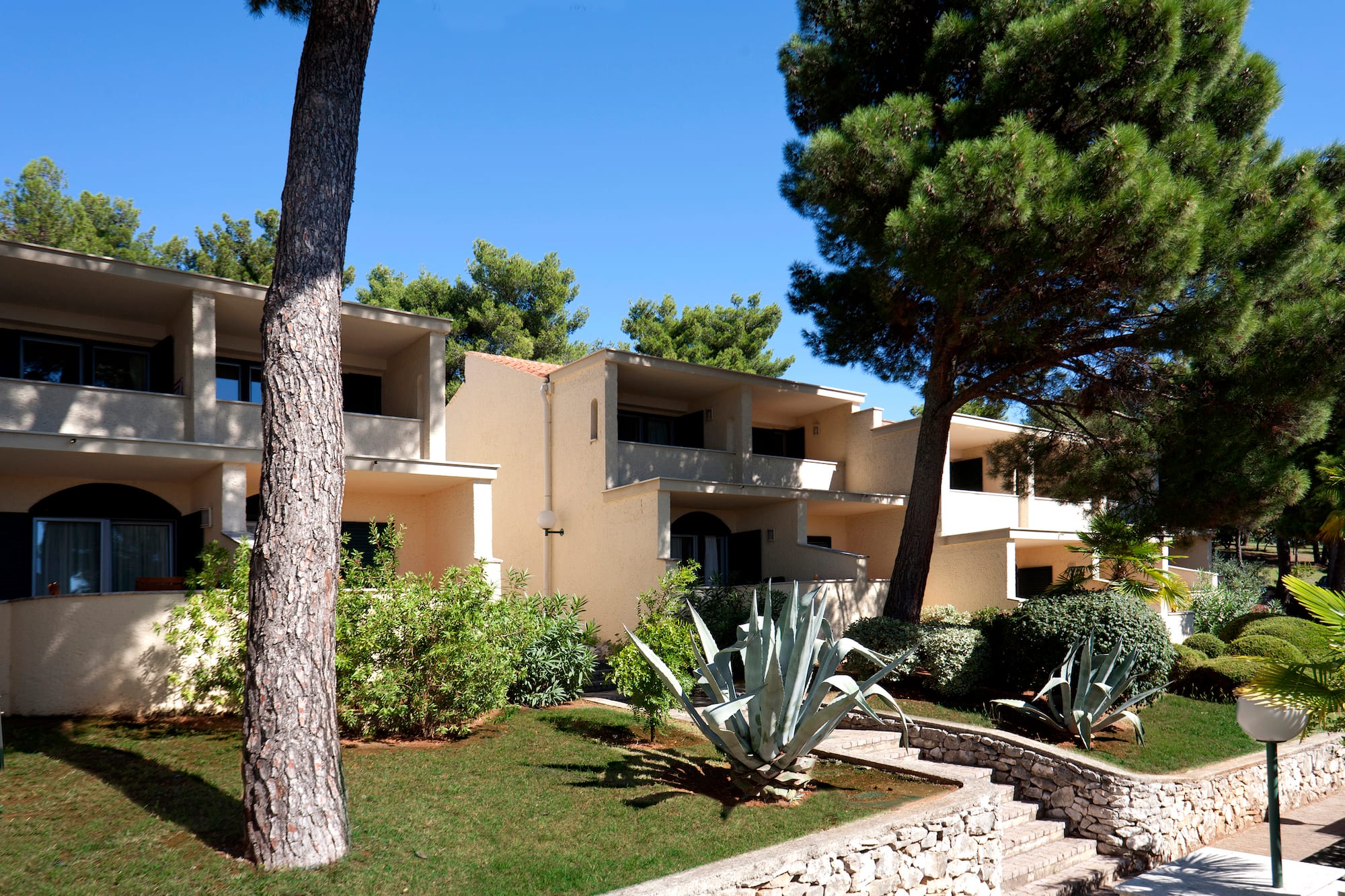 a building with trees and bushes