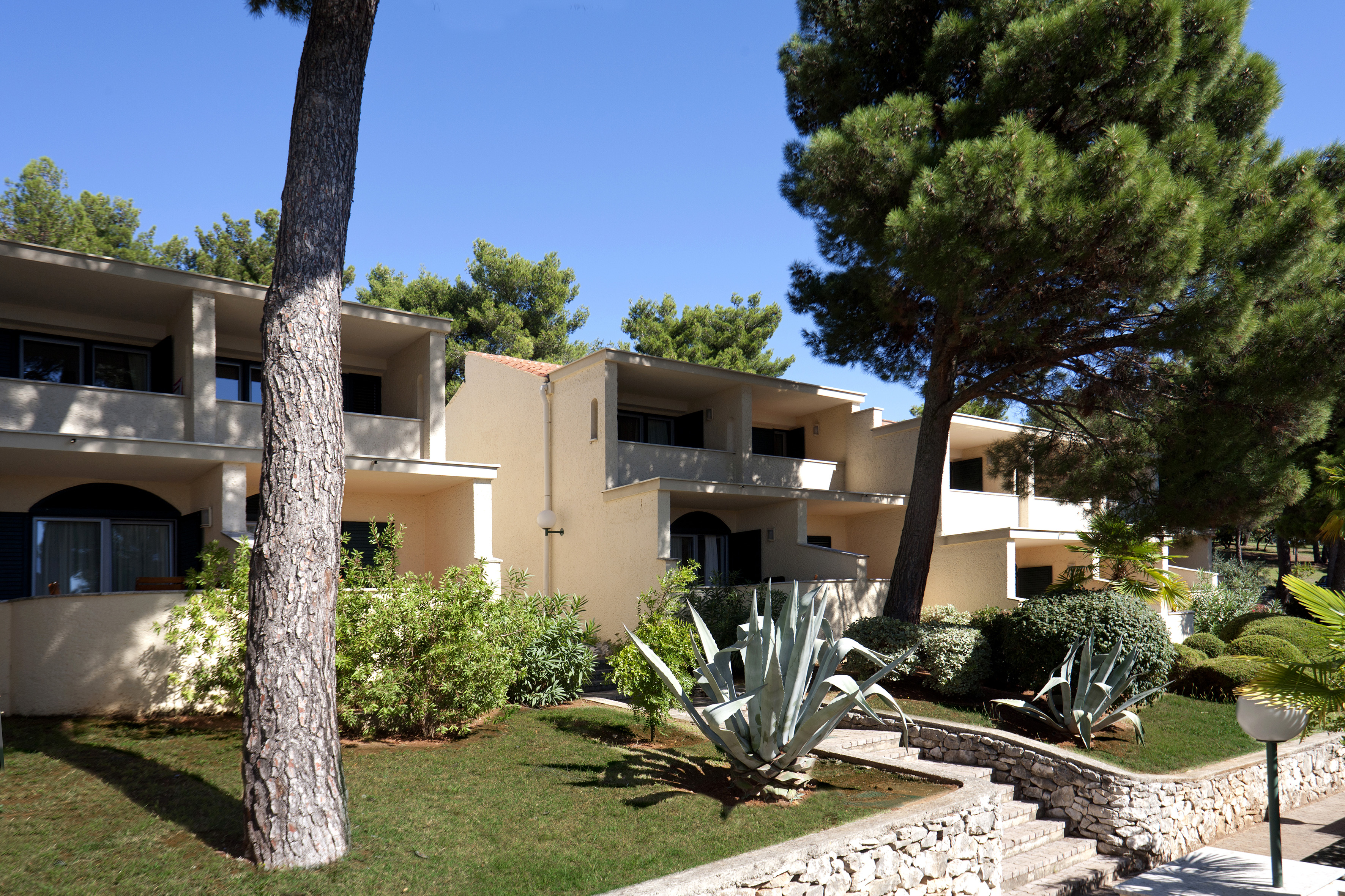 a building with trees and bushes