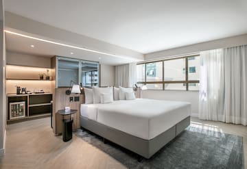 a room with a bed and a window